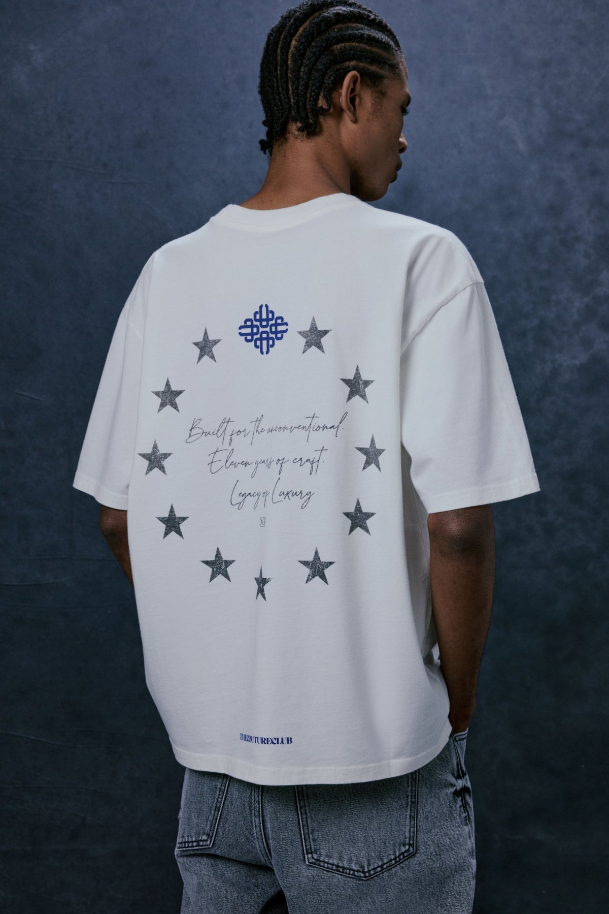 Men's Legacy Graphic T-Shirt in White – model back view showing the graphic