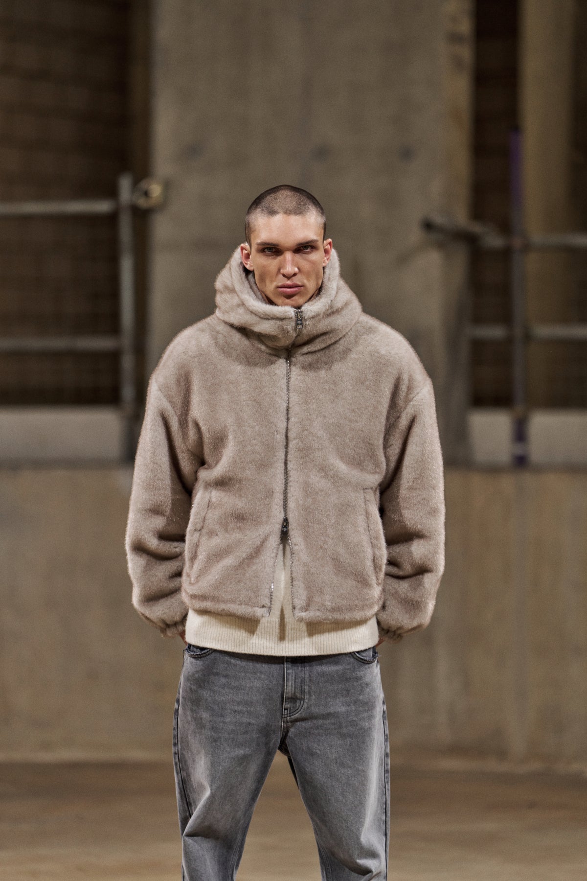Model wearing the Faux Fur Hooded Jacket in Beige, front view
