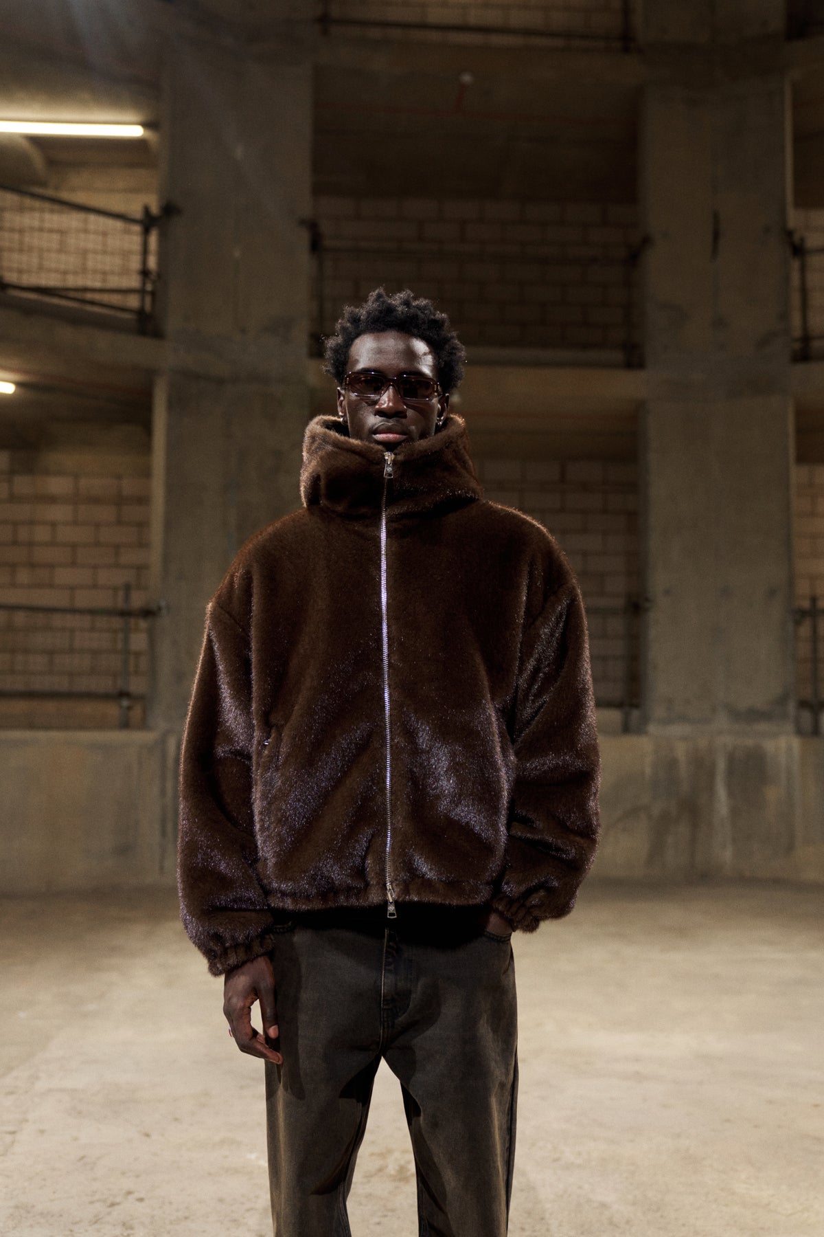 Model wearing the Faux Fur Hooded Jacket in Chocolate, front view