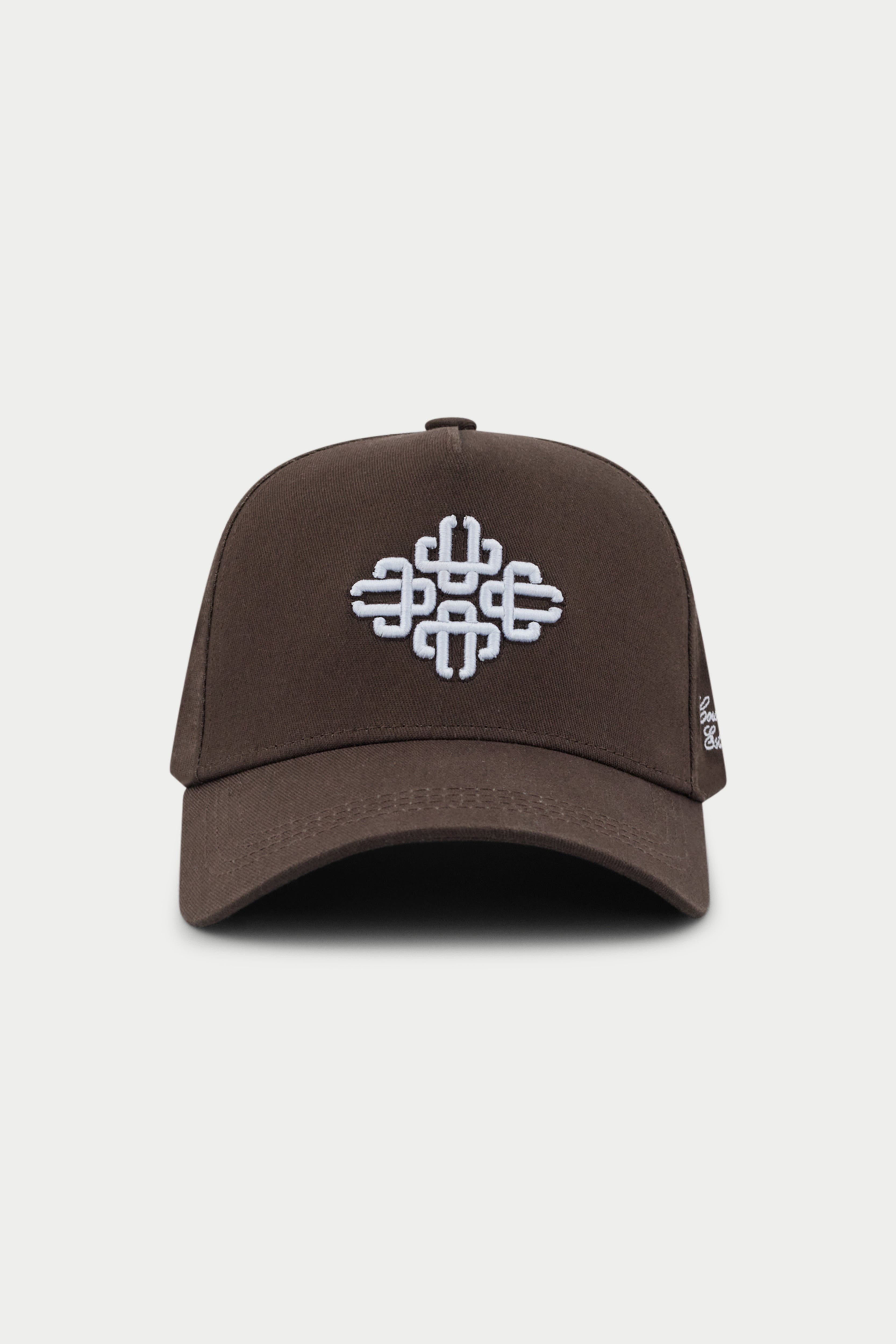 Brown cap with white emblem logo on a white background