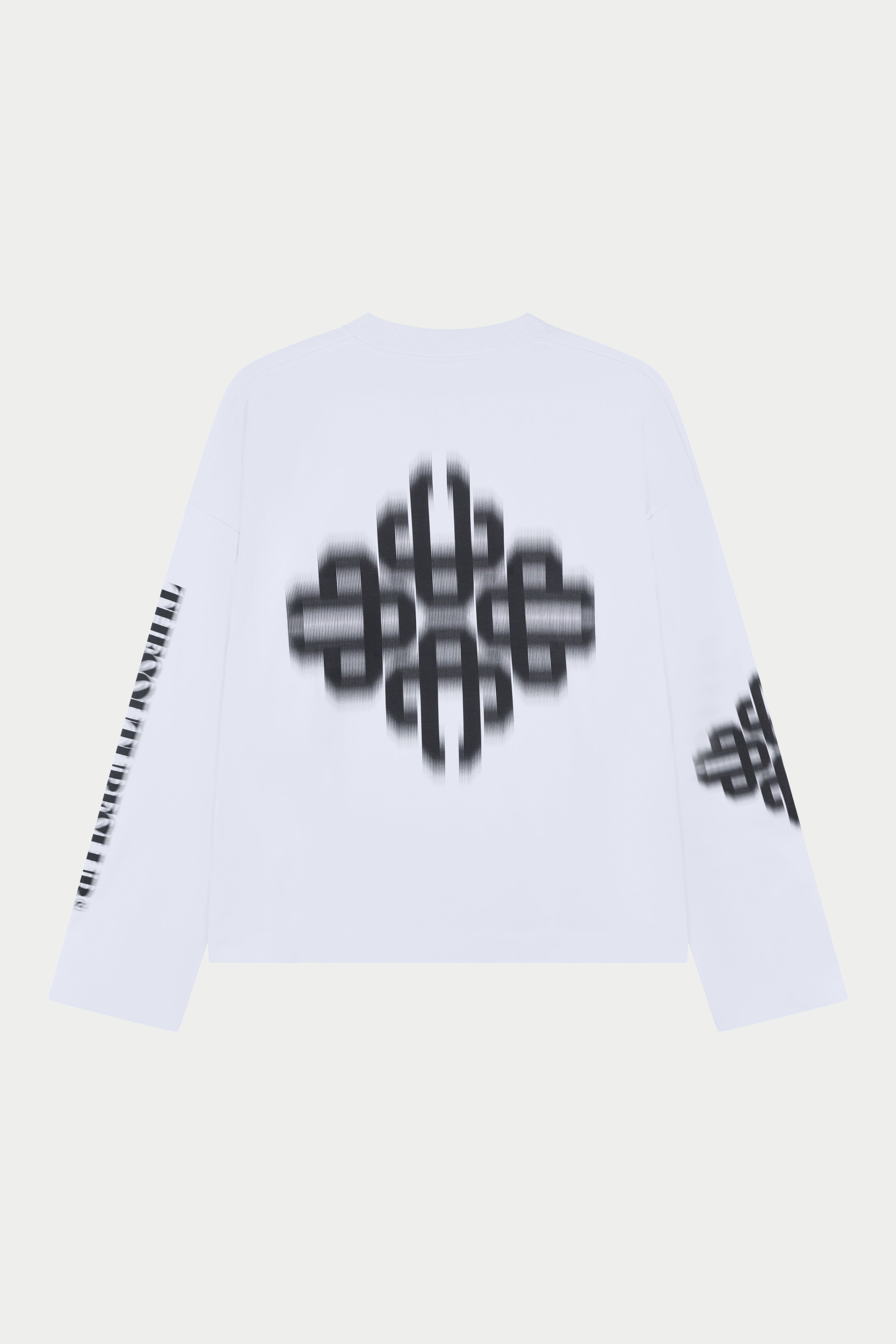 White long sleeved t-shirt with black geometric patterns on a light grey background