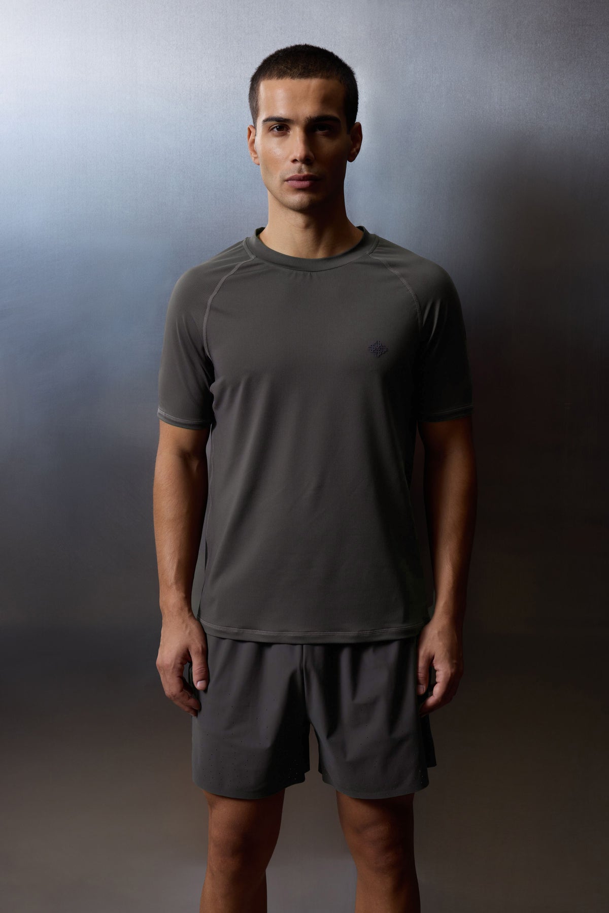 Men's Short Sleeve Training Top in Charcoal – model front view worn with black shorts