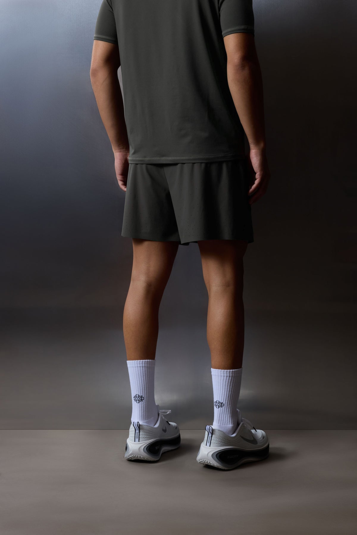 Men's Training Short in Charcoal – model side view, waist down