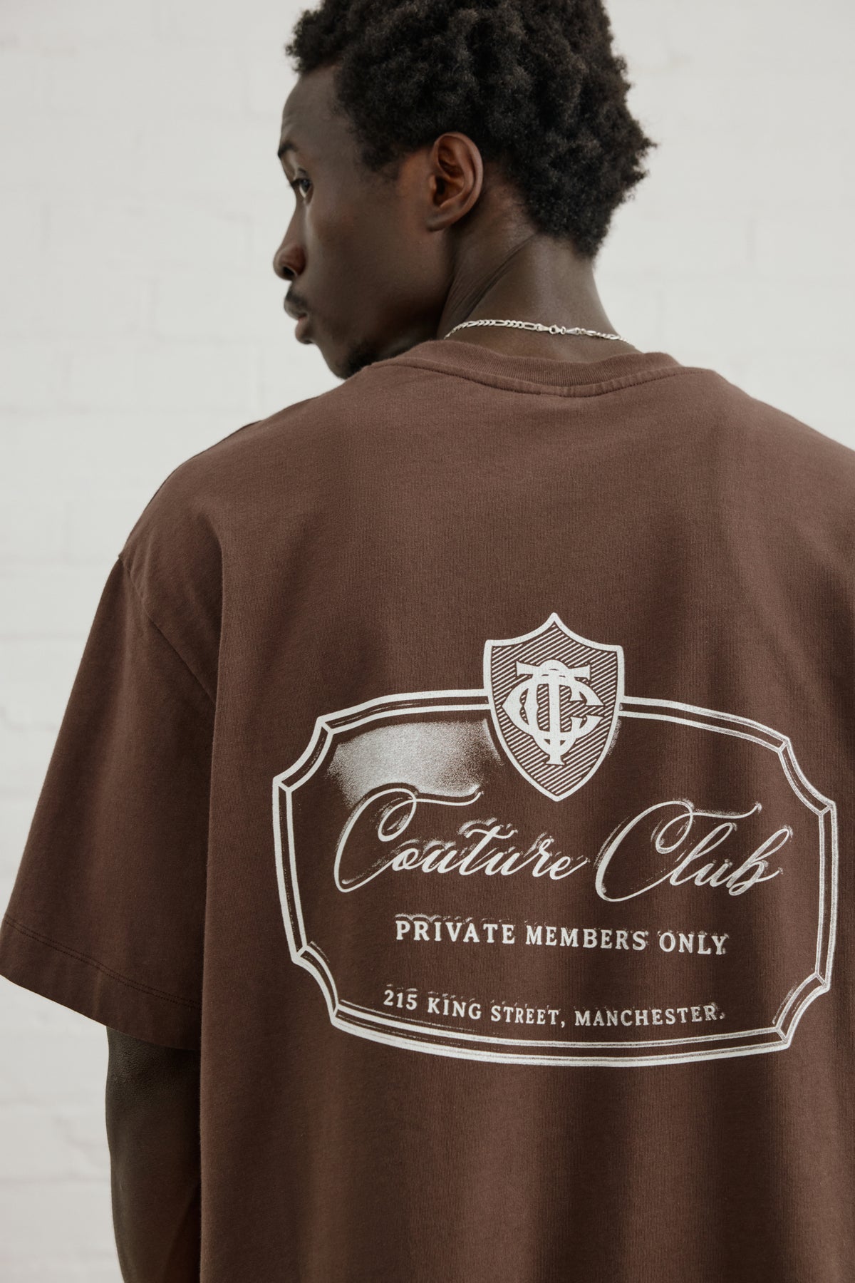 Men's Private Members Club T-Shirt in Brown – close-up of the back graphic