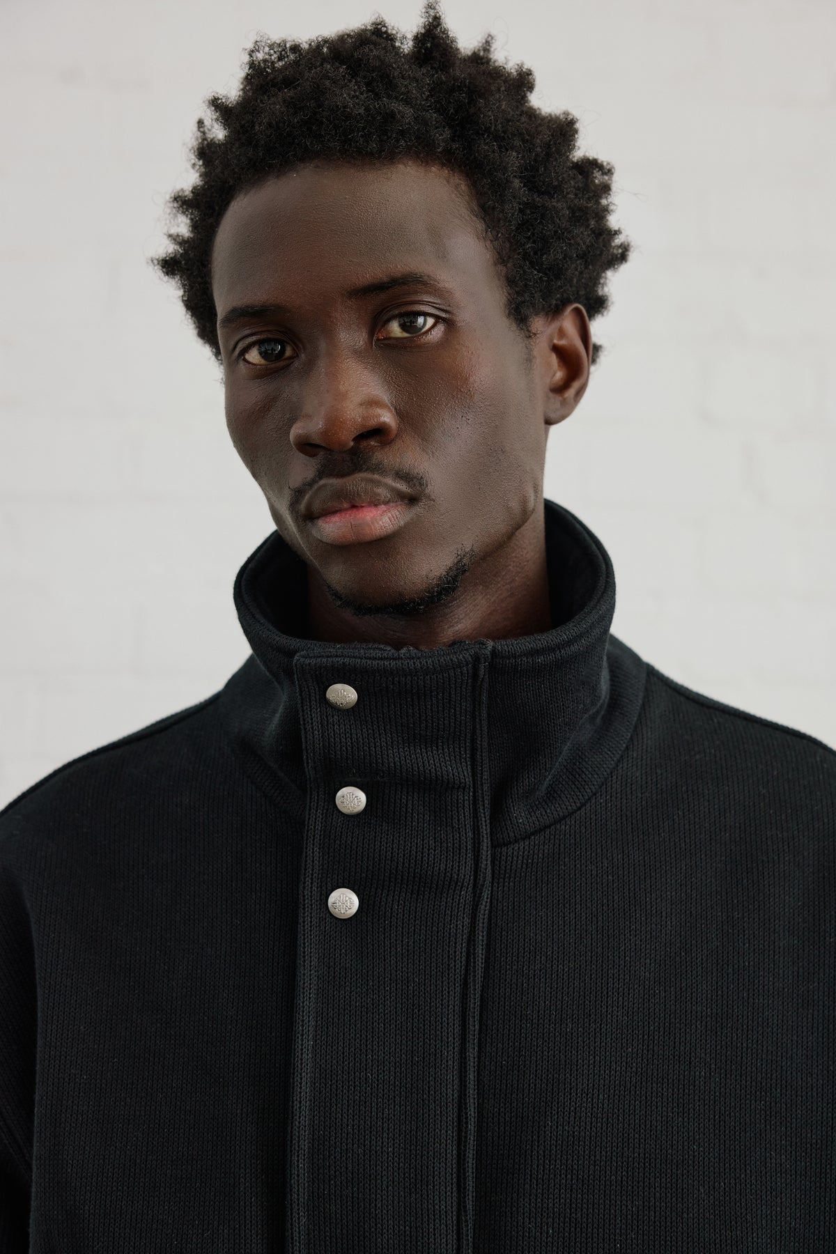 KNIT FLEECEBACK COPYRIGHT FUNNEL NECK - BLACK