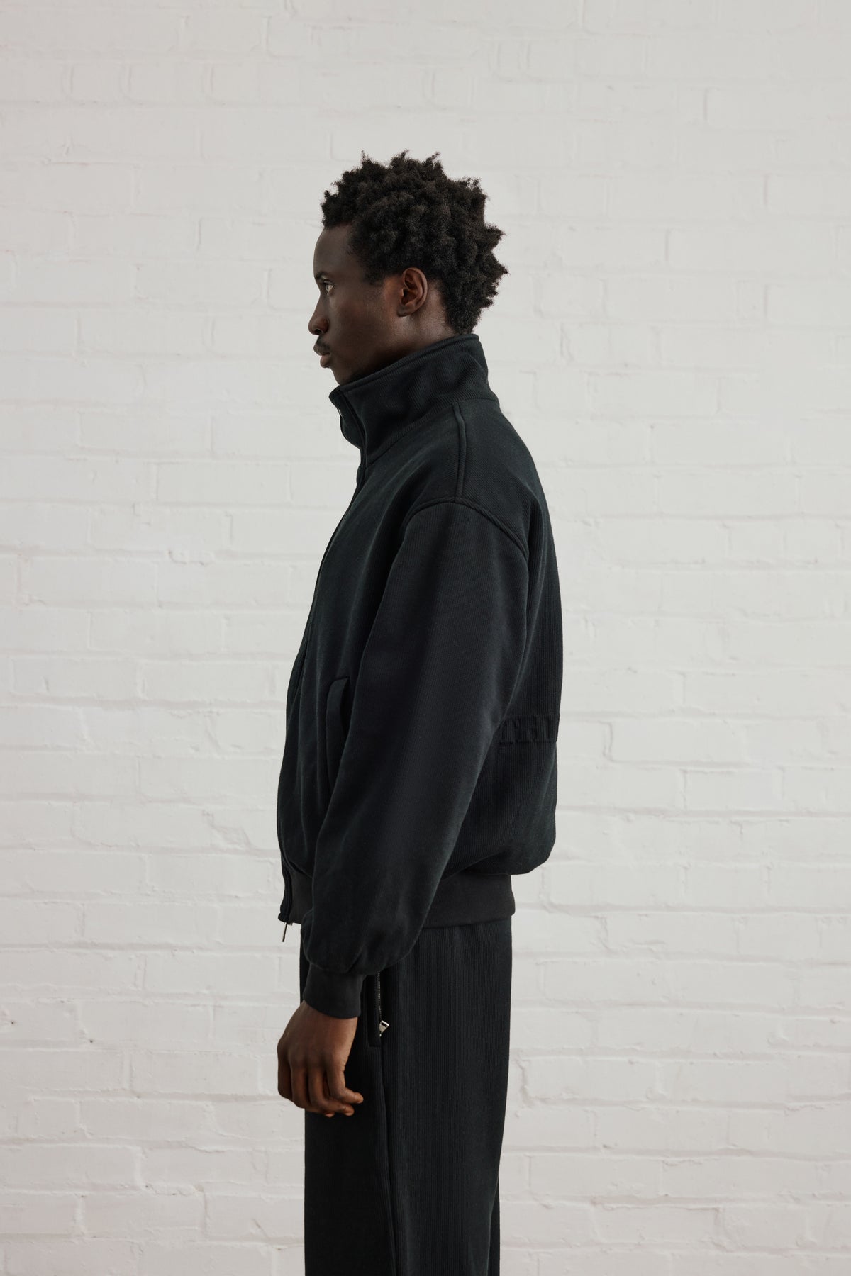 KNIT FLEECEBACK COPYRIGHT FUNNEL NECK - BLACK