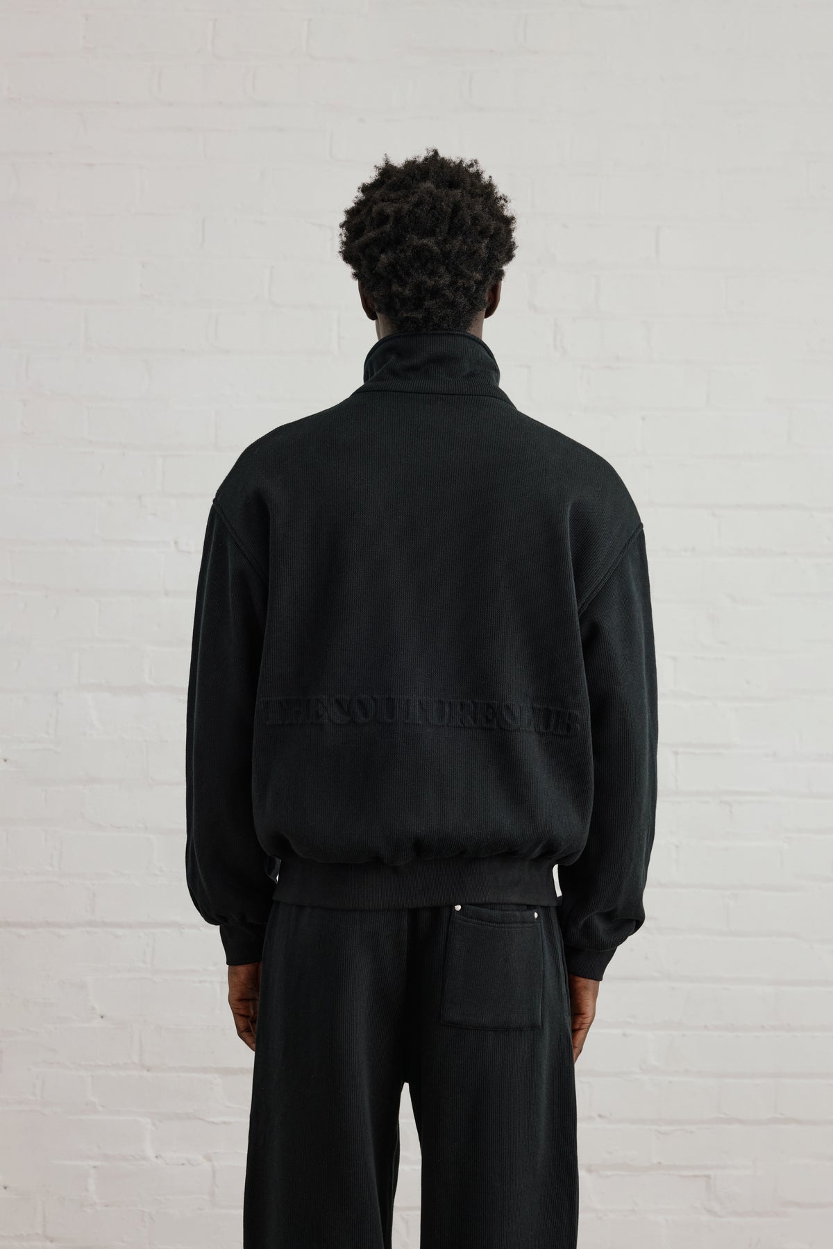 KNIT FLEECEBACK COPYRIGHT FUNNEL NECK - BLACK