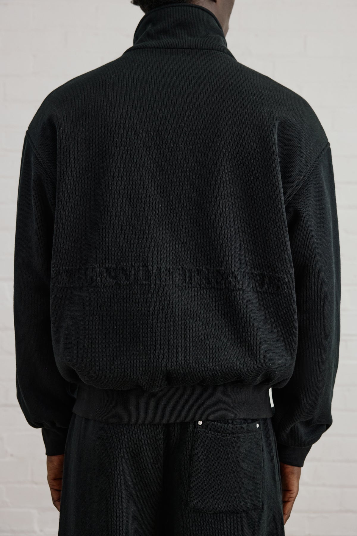 KNIT FLEECEBACK COPYRIGHT FUNNEL NECK - BLACK