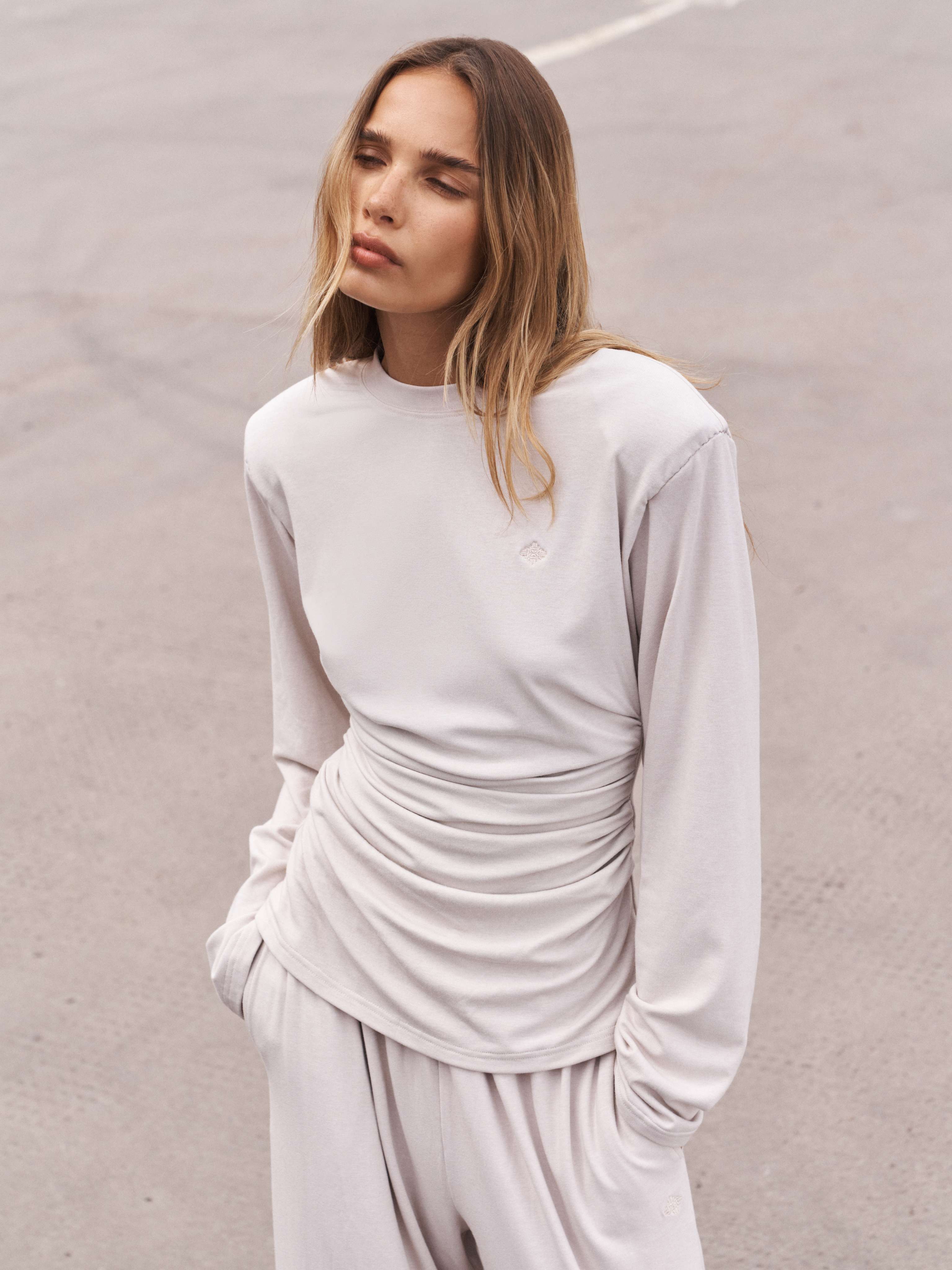 LONG SLEEVE SHOULDER PAD RUCHED TEE - BLACK | The Couture Club