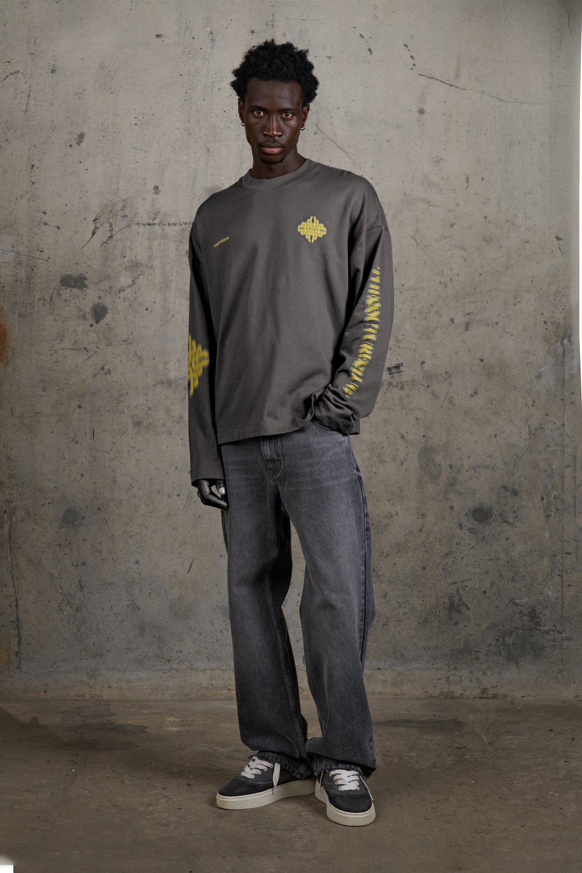 Model wearing the Motion Blurred Long Sleeve T-Shirt in Charcoal/Yellow, full-length front view