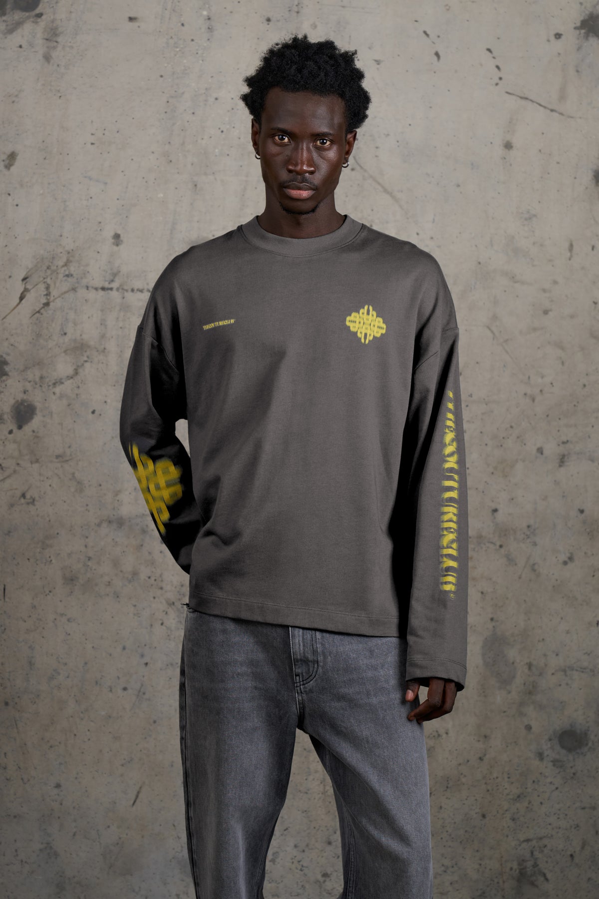 Model wearing the Motion Blurred Long Sleeve T-Shirt in Charcoal/Yellow, front view
