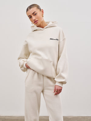 COUTURE SCRIPT PUFF SLEEVE HOODIE - OFF WHITE