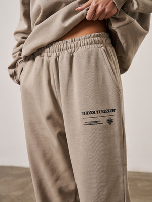 MULTI GRAPHIC RELAXED JOGGERS - BEIGE