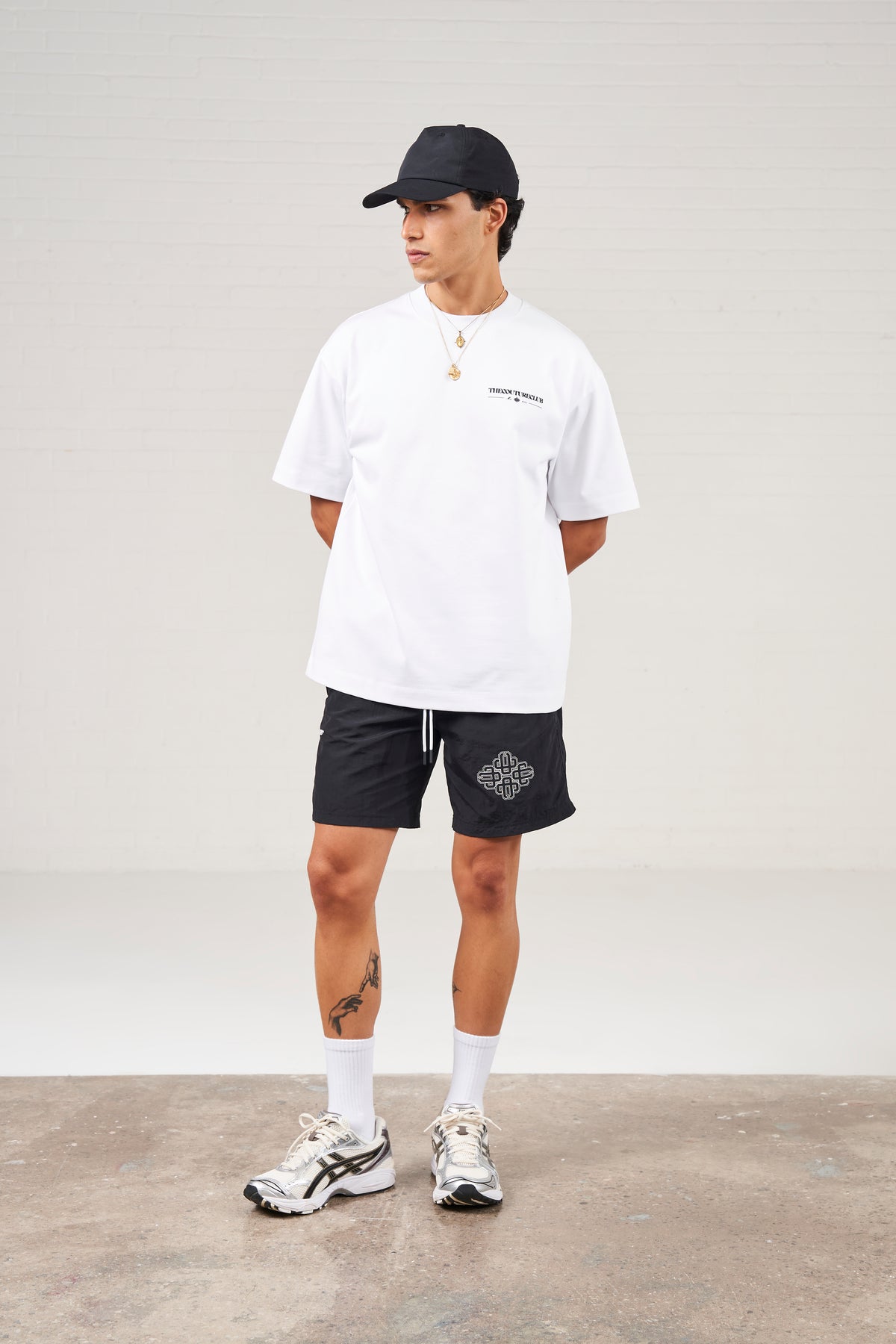 COPYRIGHT EMBLEM MID LENGTH SWIM SHORTS - BLACK
