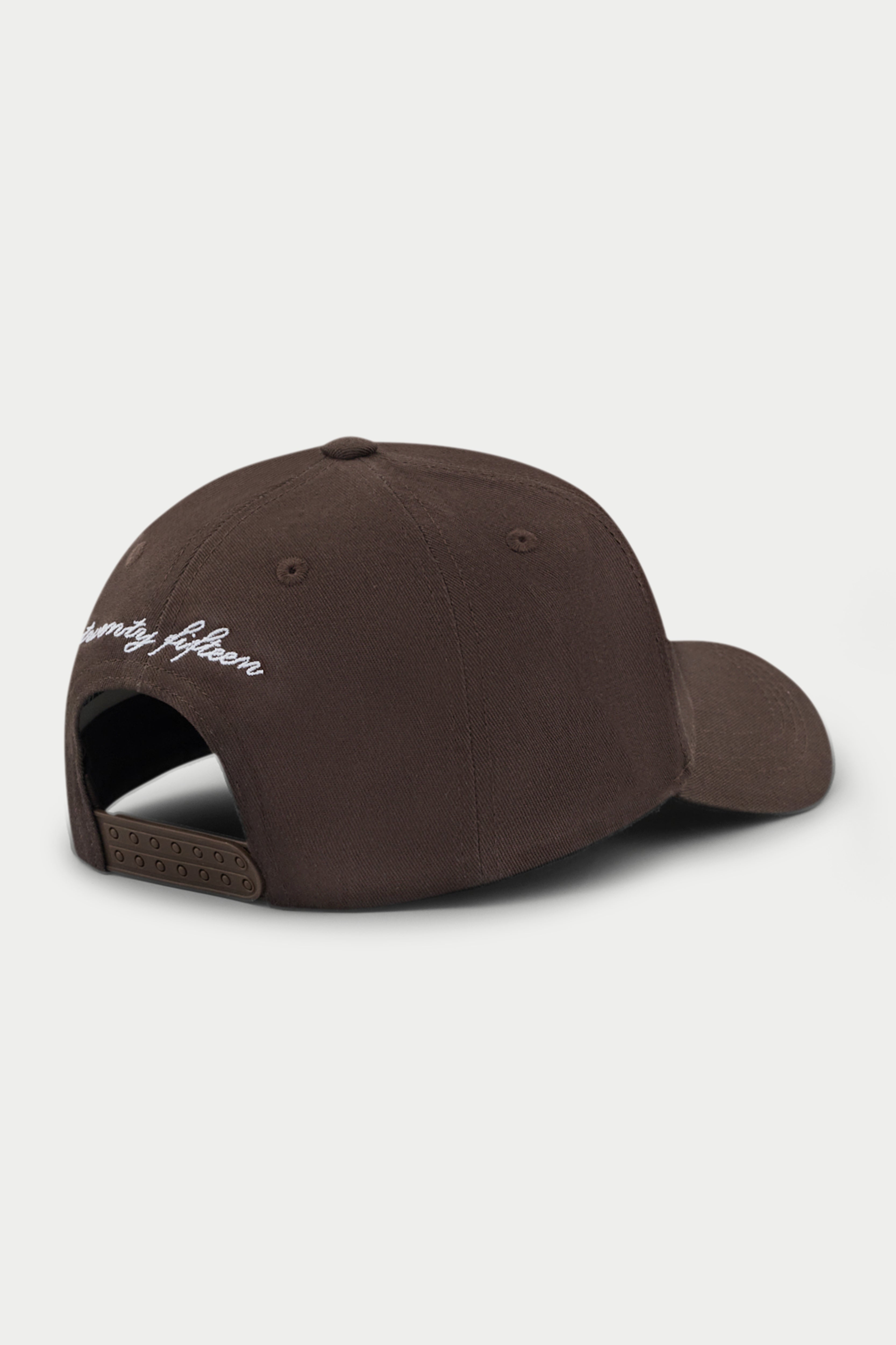 Brown cap with white emblem logo on a white background
