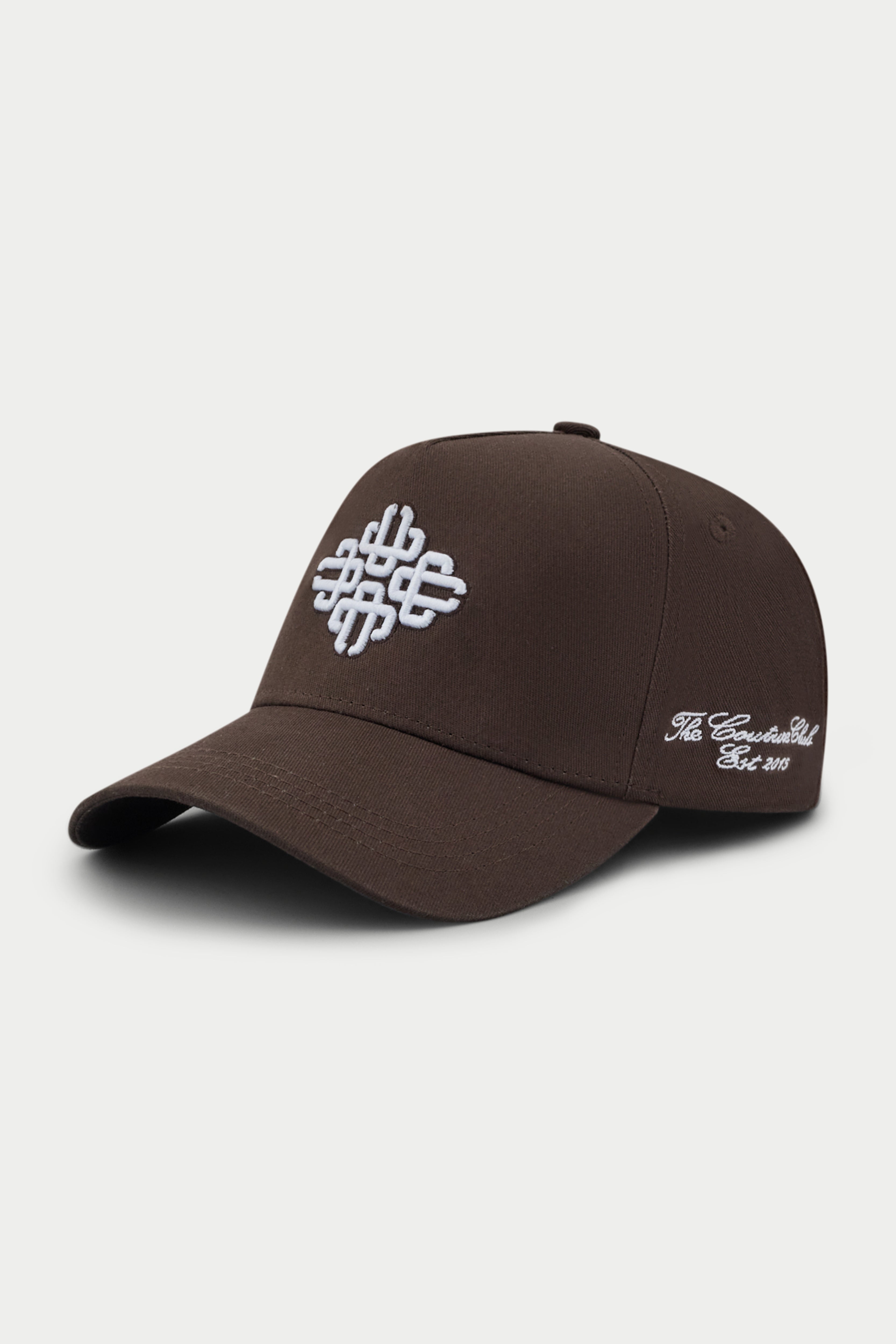 Brown cap with white emblem logo on a white background