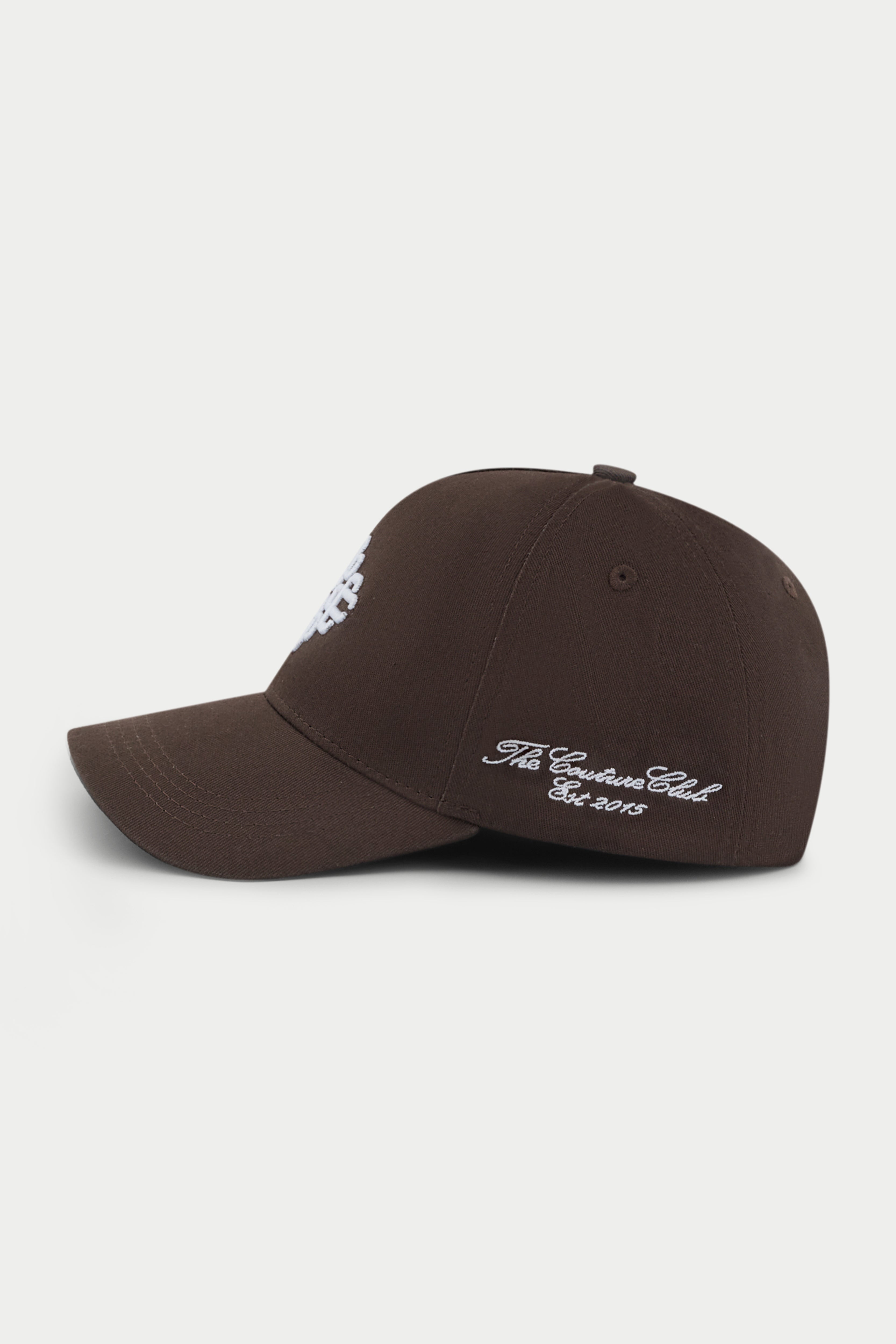 Brown cap with white emblem logo on a white background