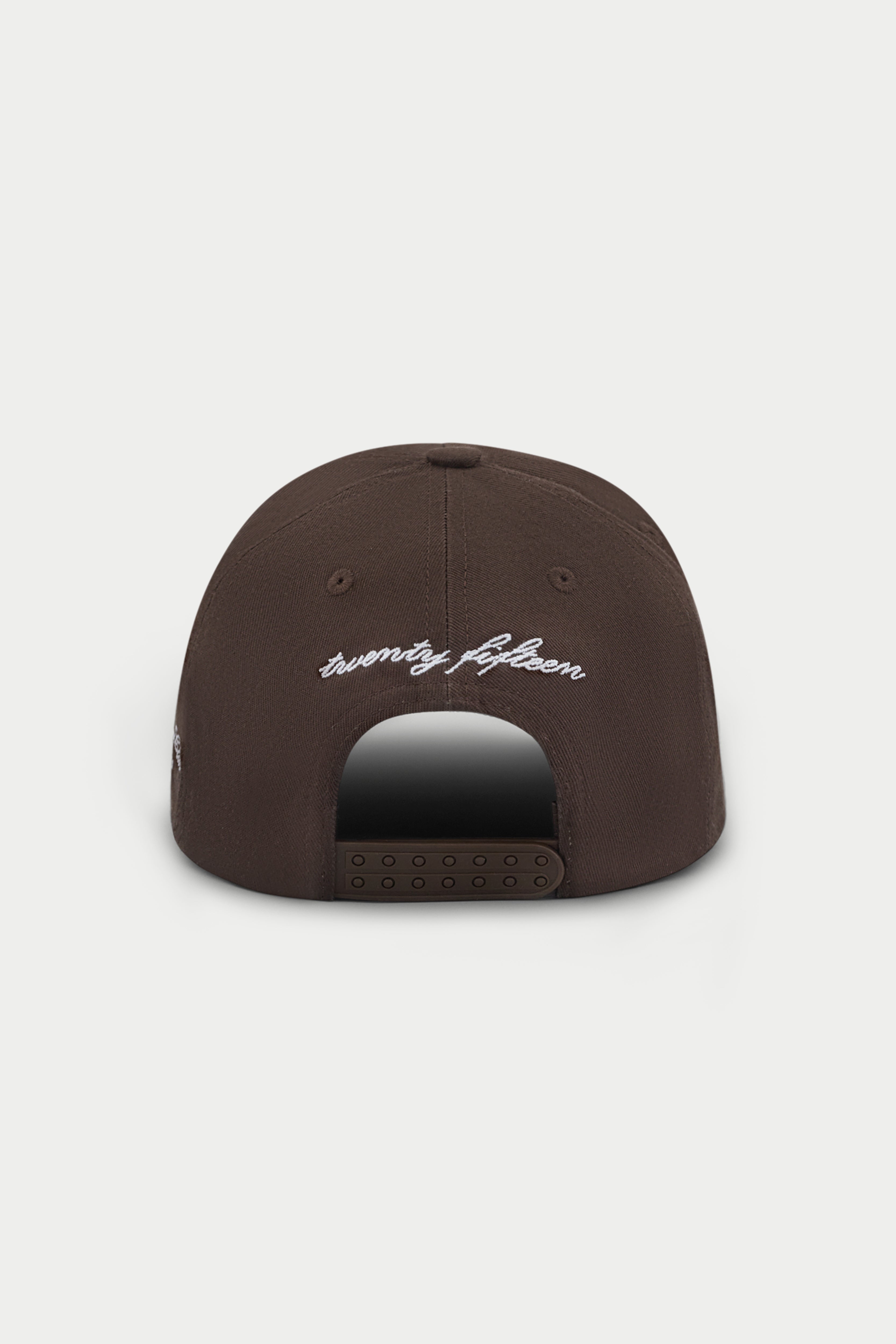 Brown cap with white emblem logo on a white background