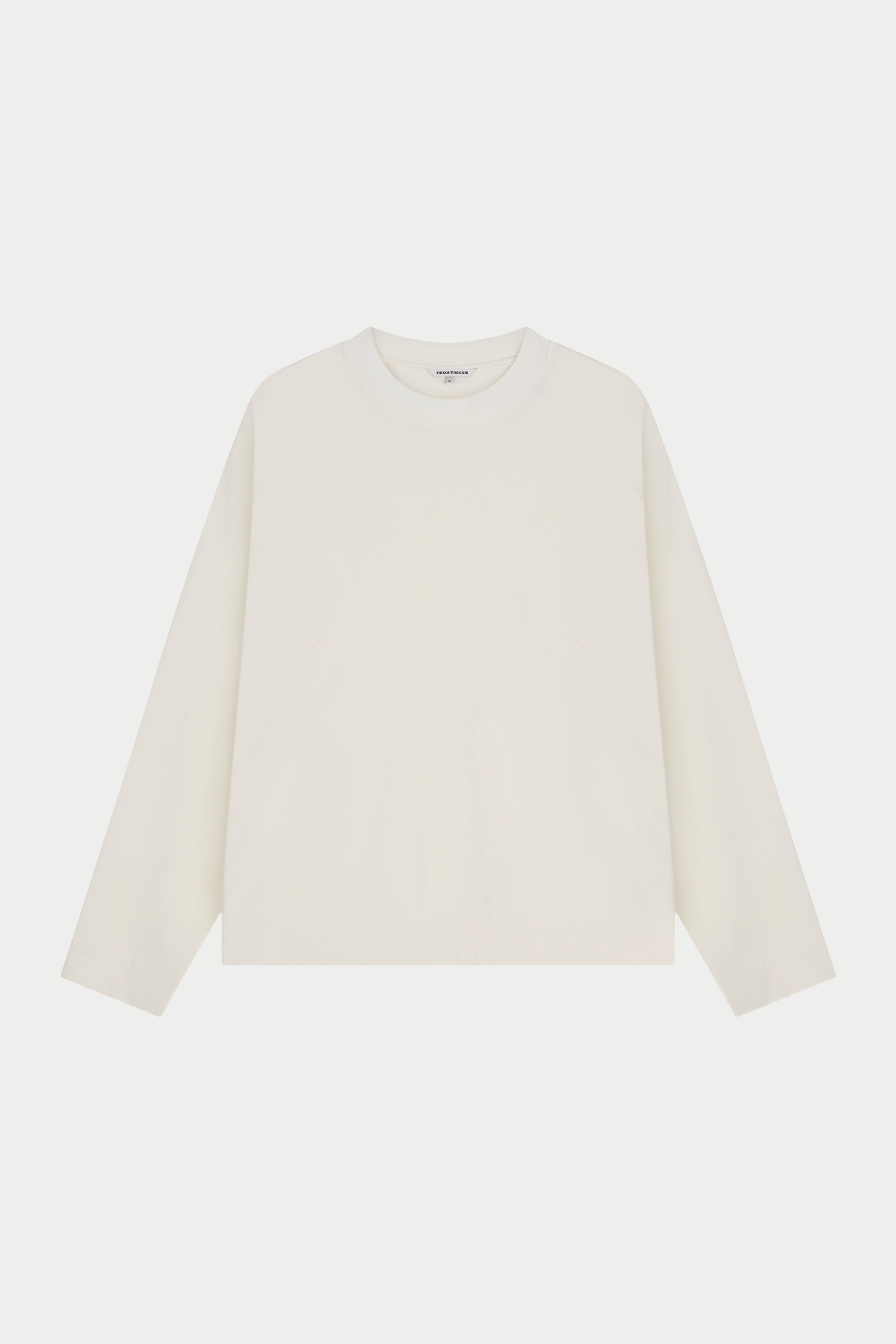 Off white t-shirt on a light beige background