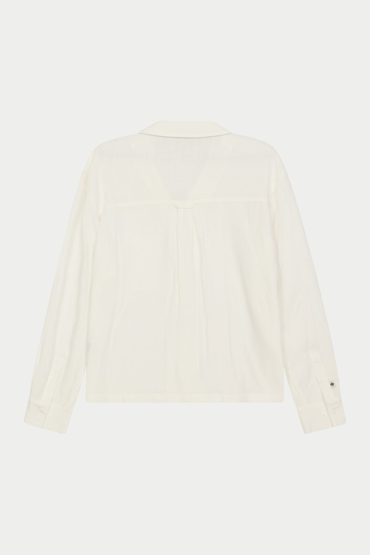A white, long-sleeved, relaxed fit woven shirt with a revere collar displayed on a plain background.