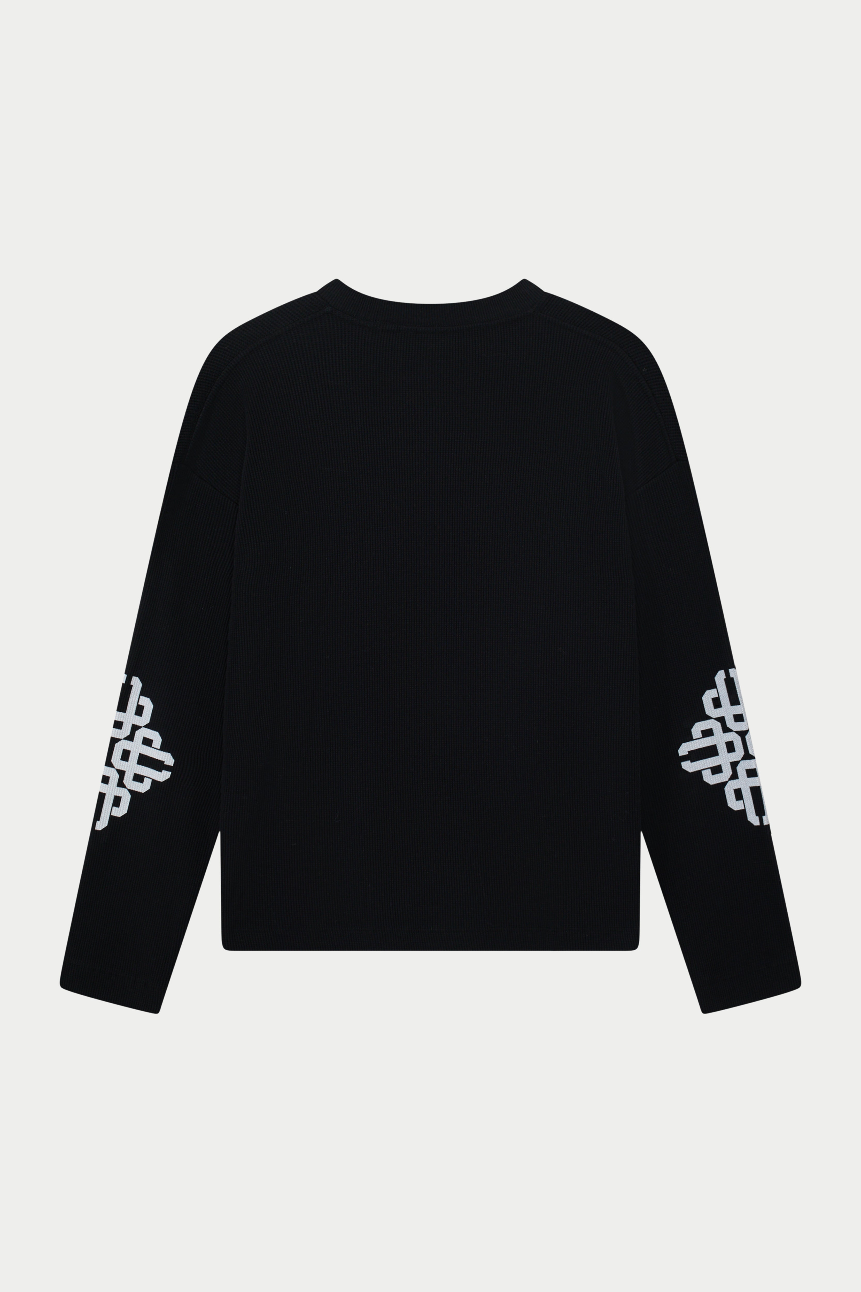Black long sleeve t-shirt with white patterns on sleeves against a light grey background