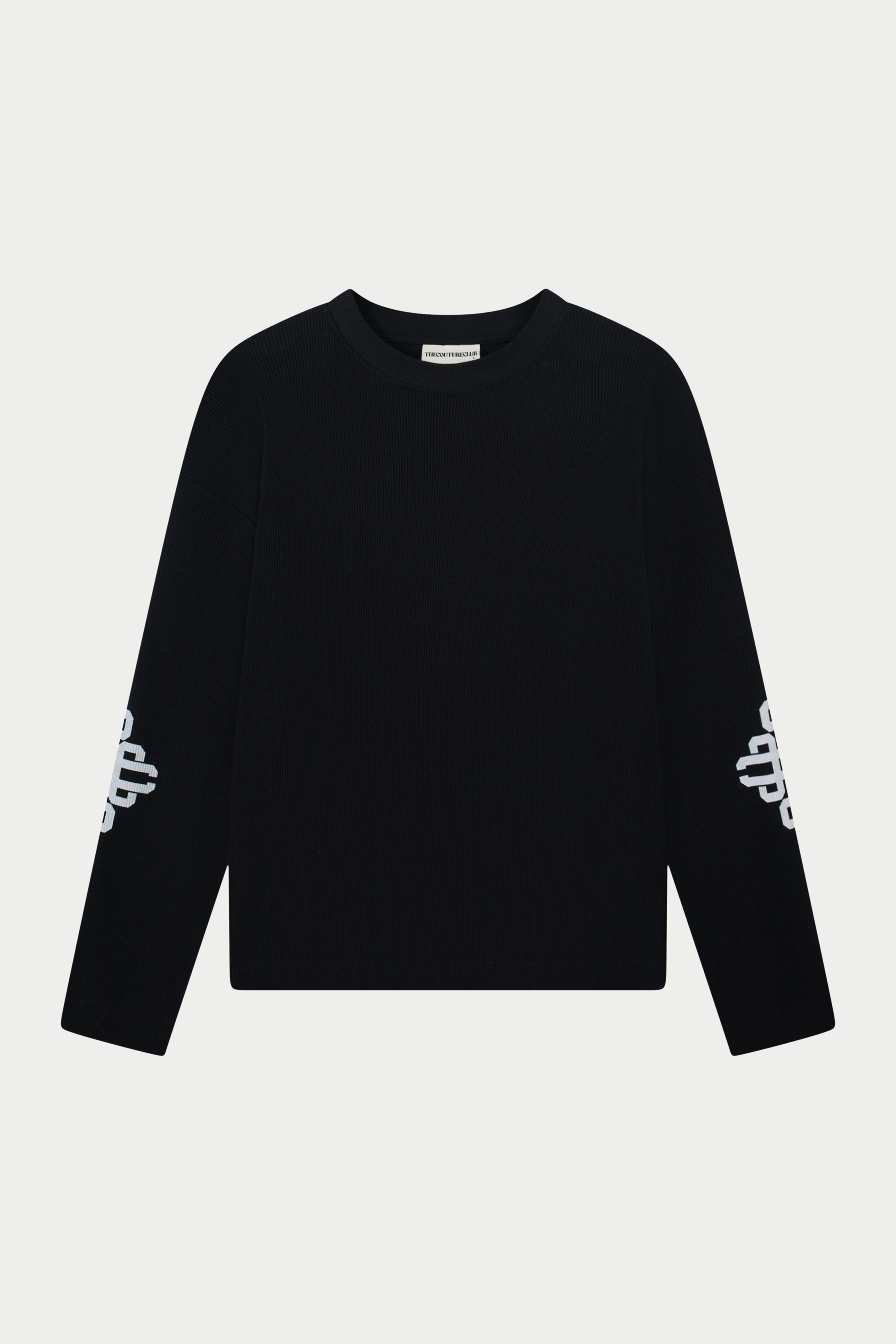 Black long sleeve t-shirt with white branding on sleeves against a light grey background