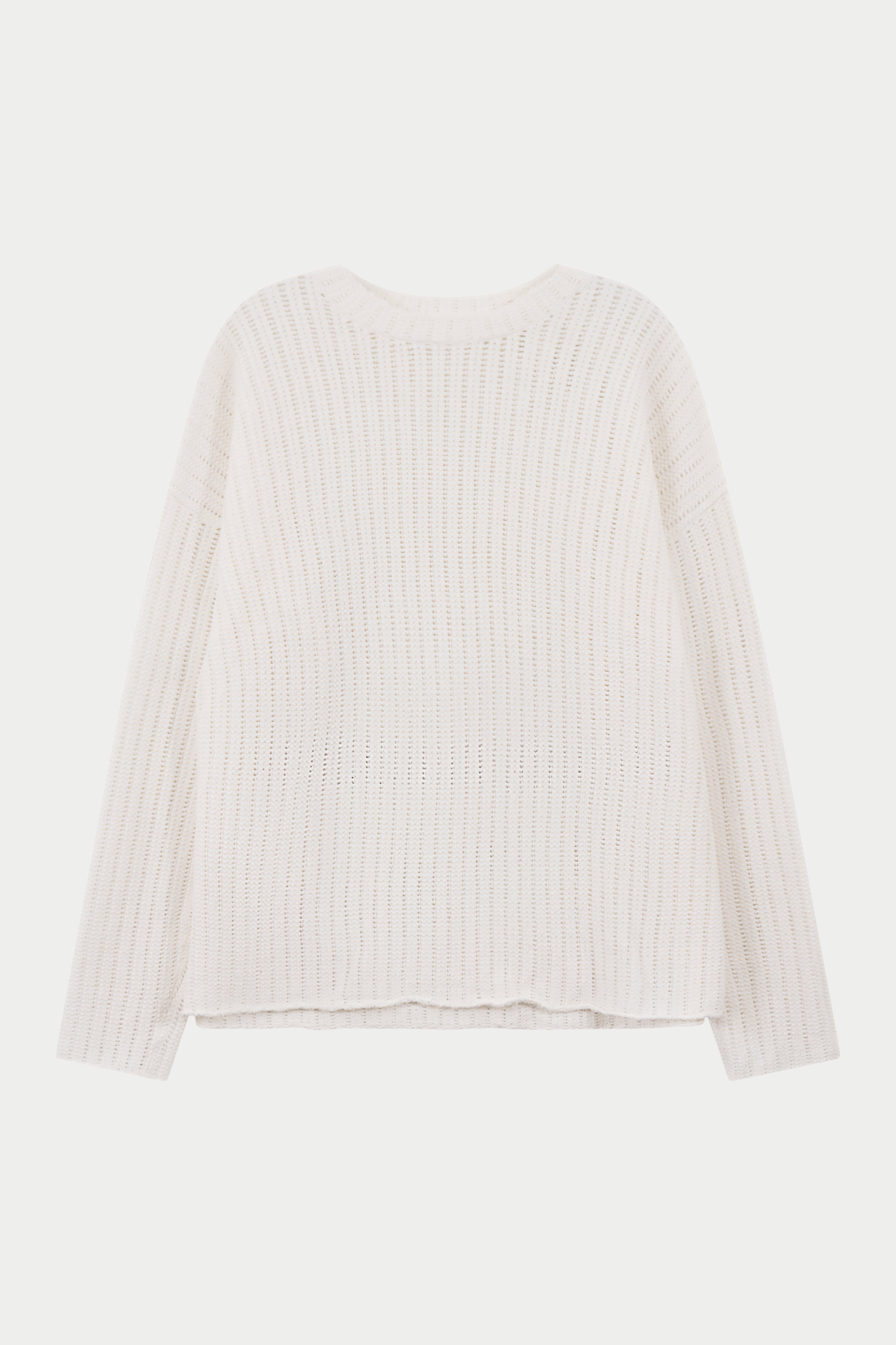 White crochet knitted long sleeve t-shirt on a light background