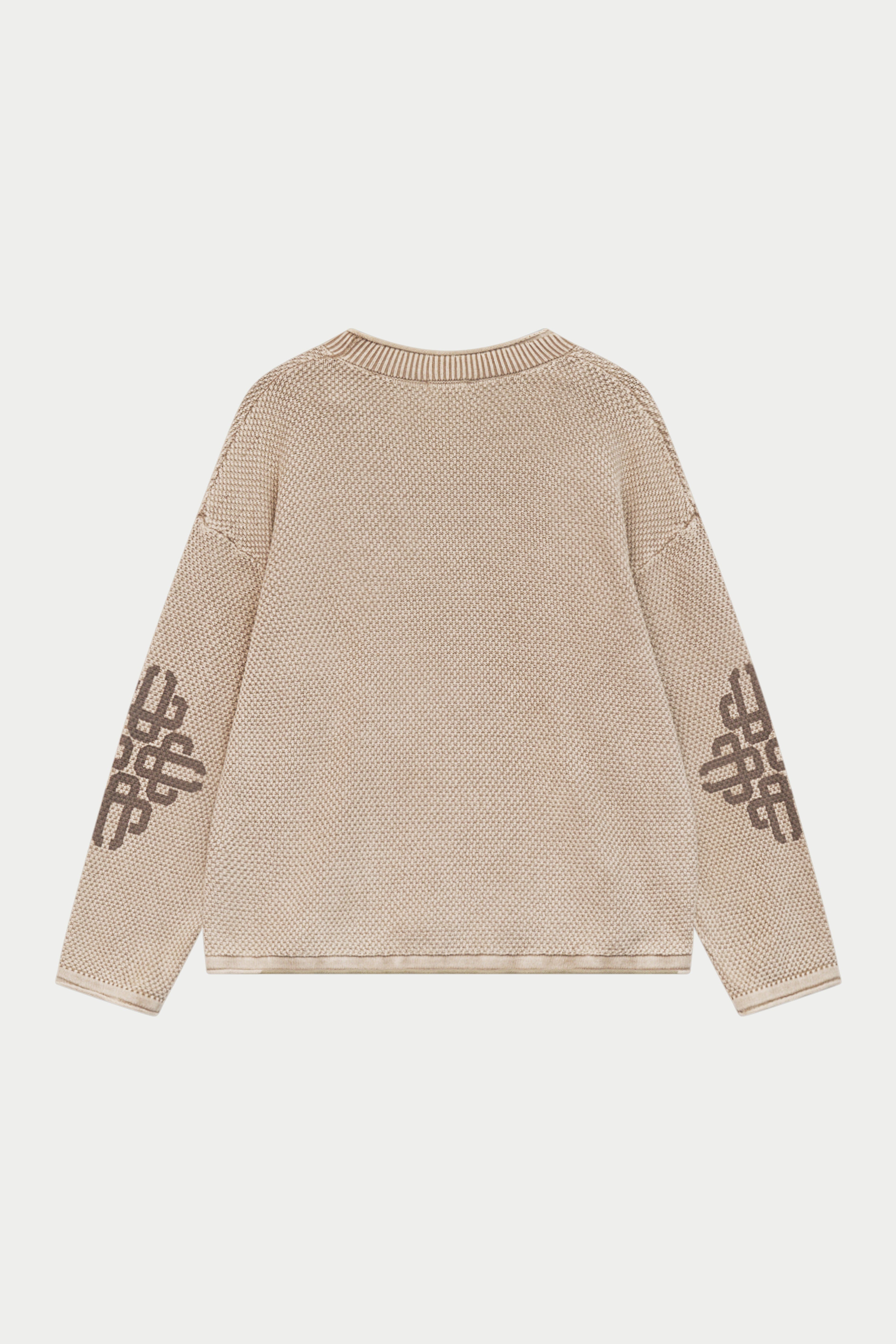 A beige knit sweater shown from the back, featuring dark brown geometric patterns printed on both sleeves, set against a light gray background.