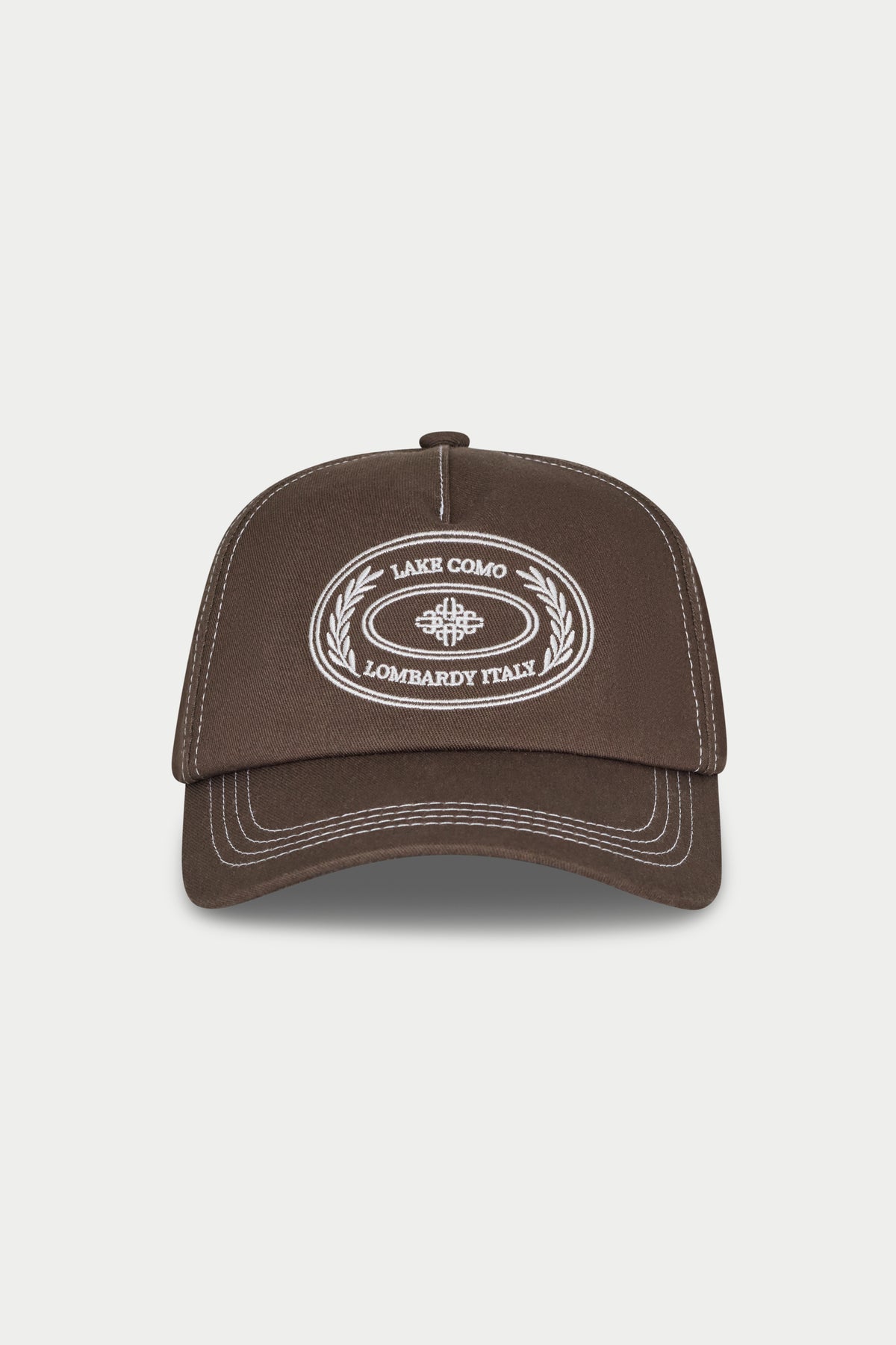 Brown cap with white embroidery on a white background