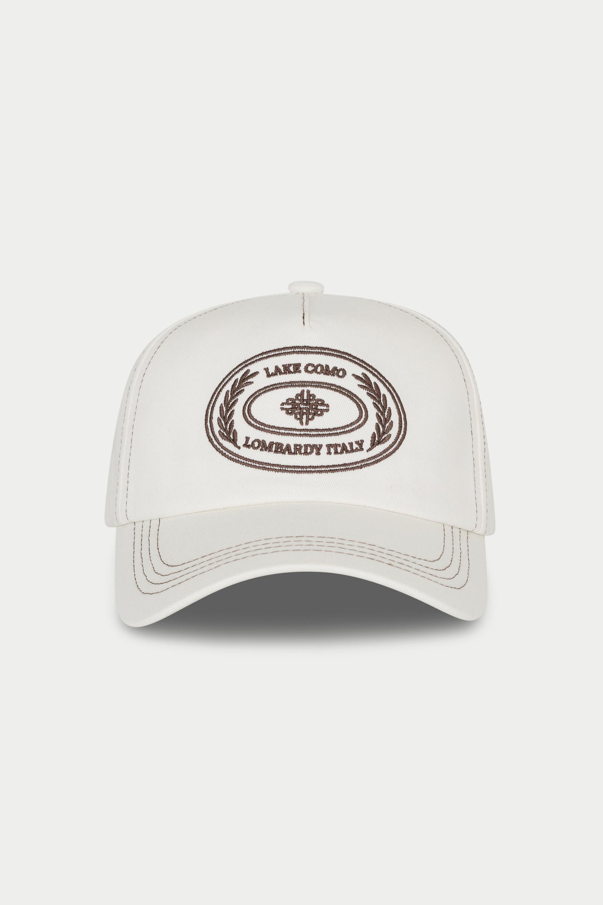 White cap with brown logo and text on a white background