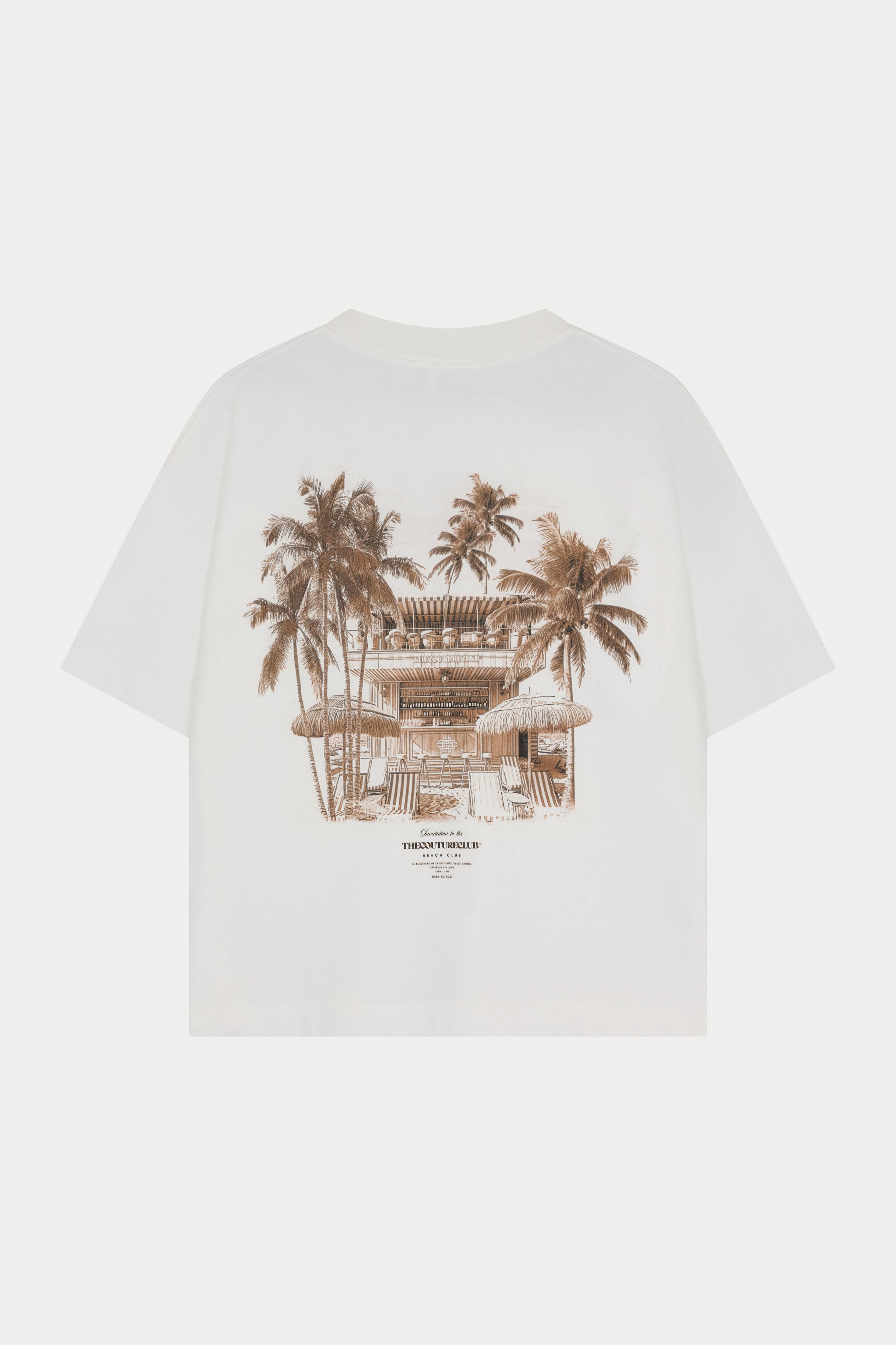 White t-shirt with palm tree and beach club graphic on a white background