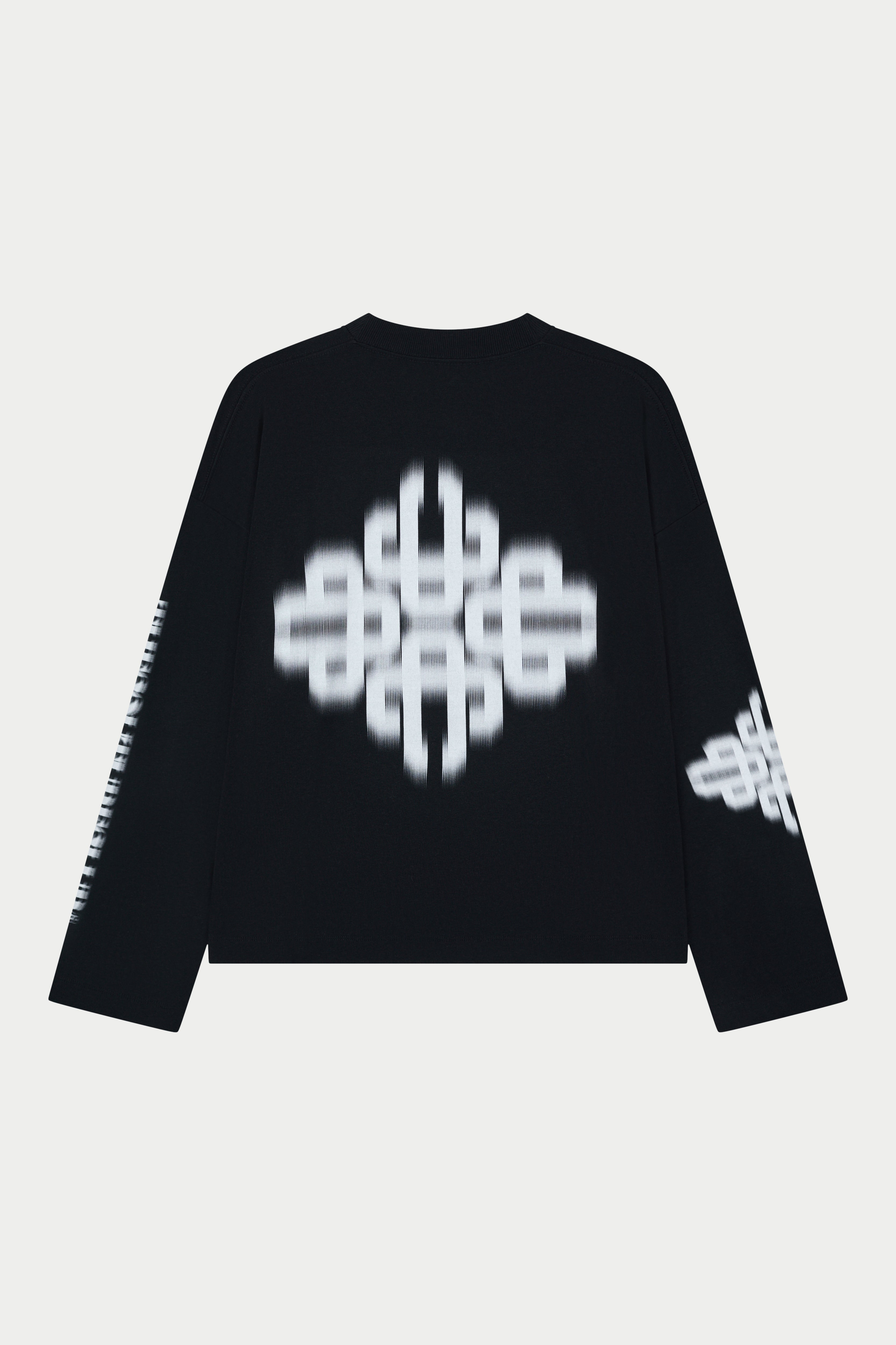 Black long sleeved t-shirt with white geometric patterns on a light grey background
