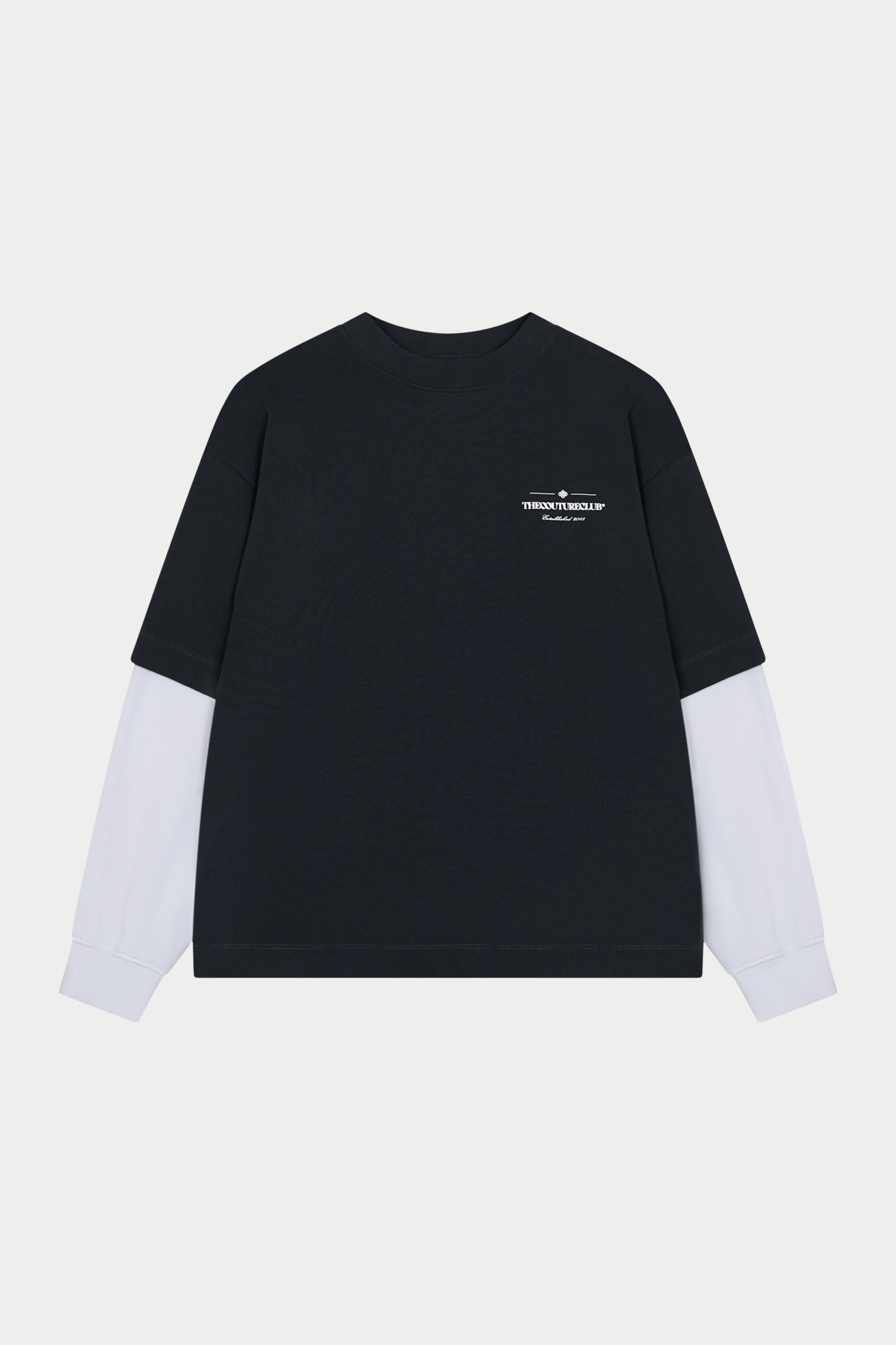 Black and white long-sleeve shirt with a logo on a light gray background