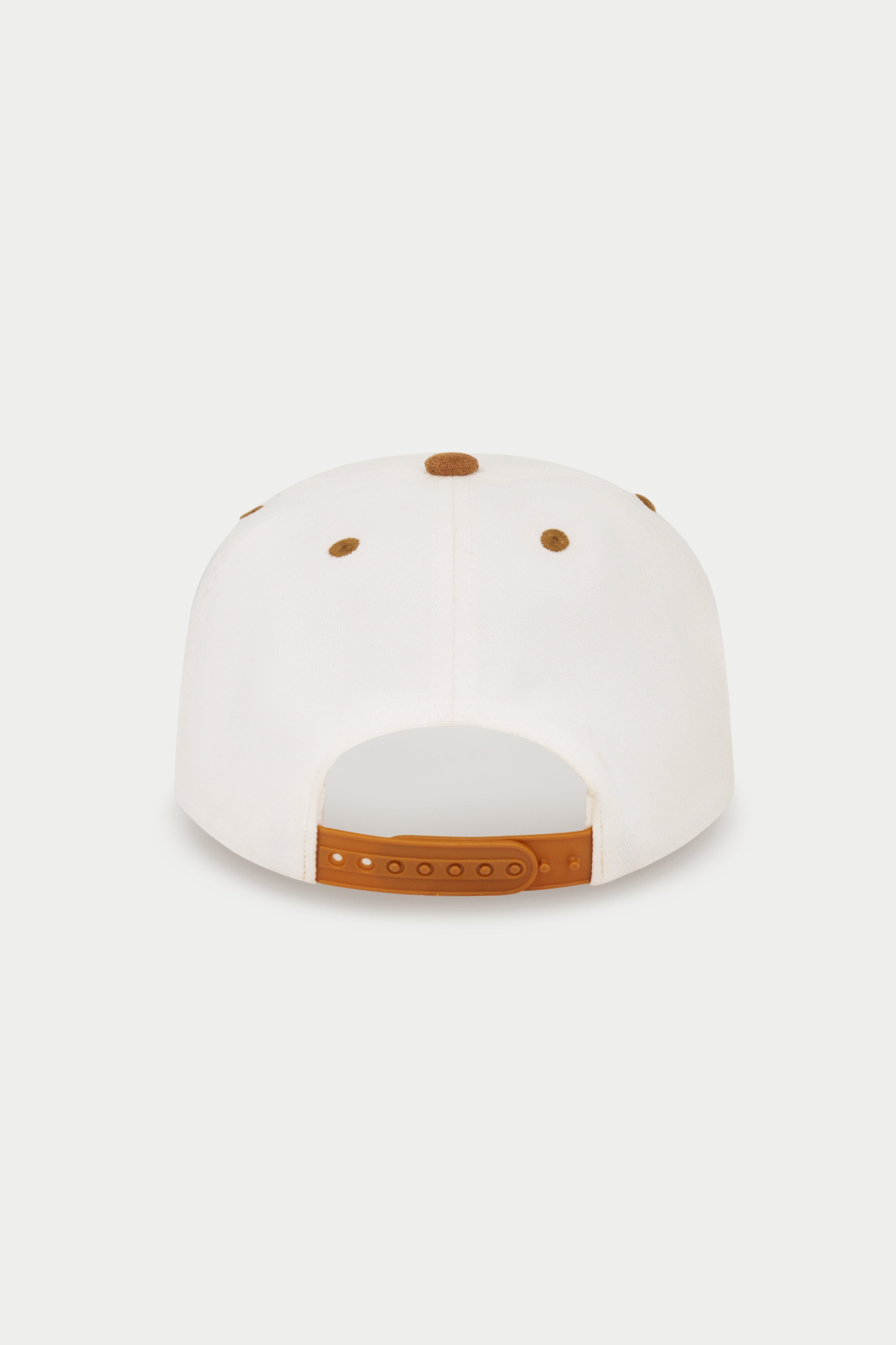 The back of a white baseball cap with brown leather-like adjustment straps and matching brown eyelets, shown on a light gray background.