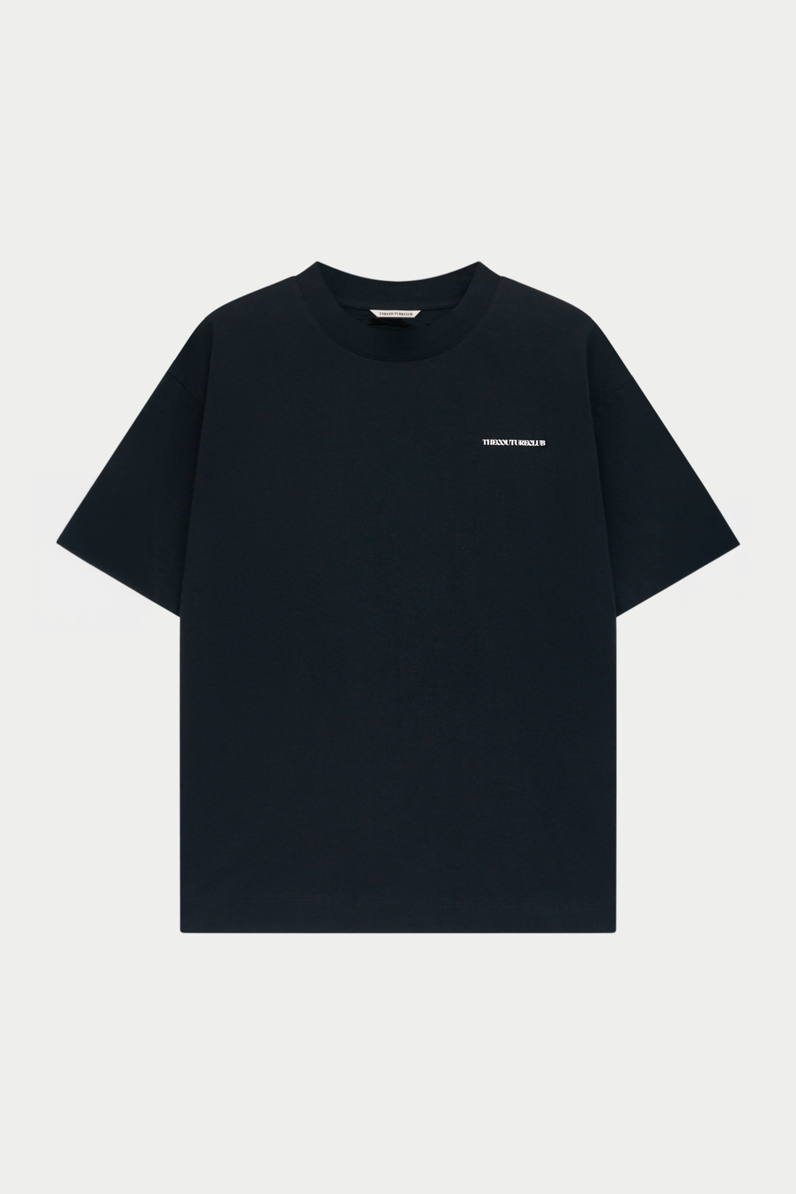 A black short-sleeve crewneck t-shirt with a small white 'The Couture Club' logo printed on the left chest, displayed against a light gray background.