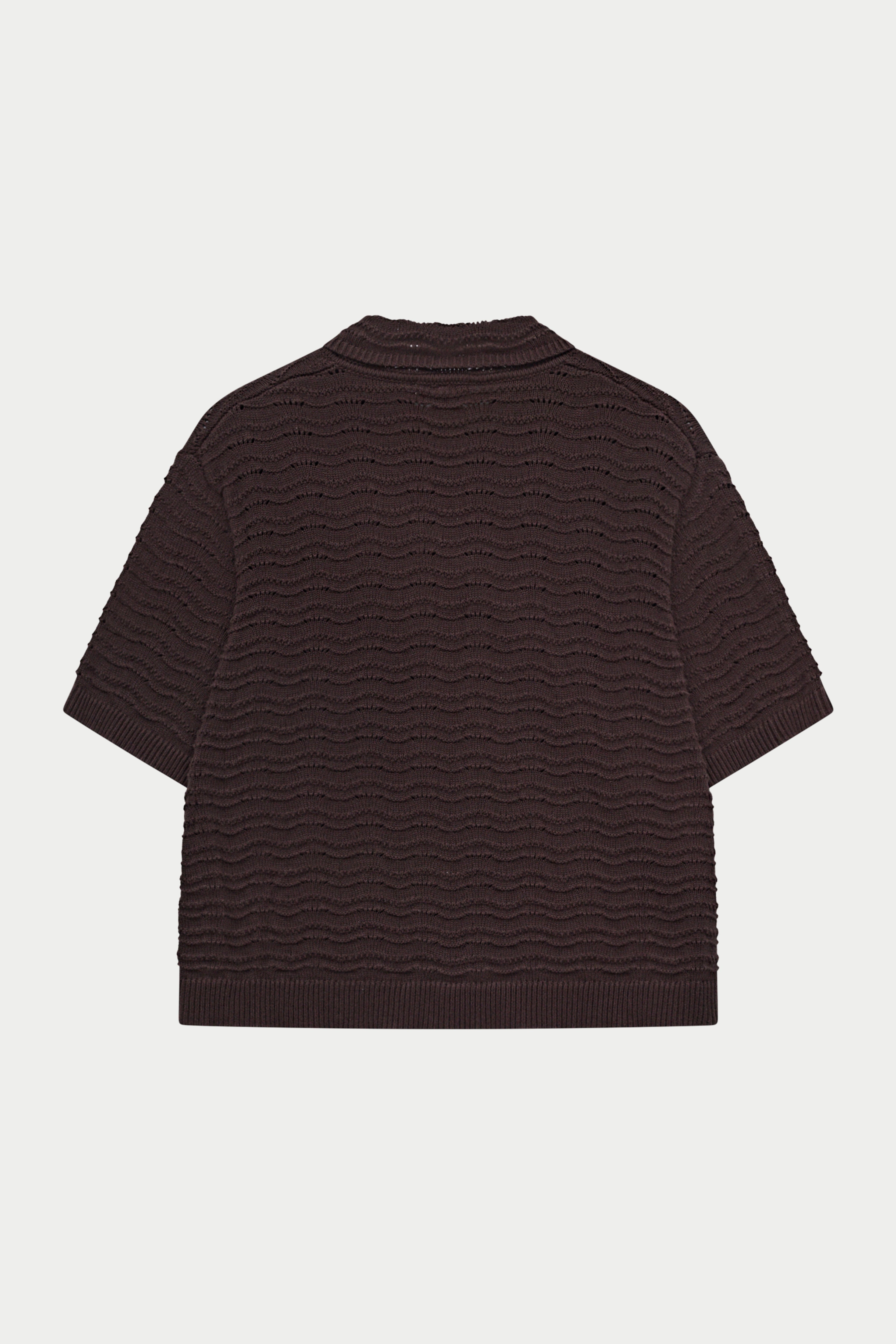 Dark brown crochet knit short sleeved shirt on a white background.