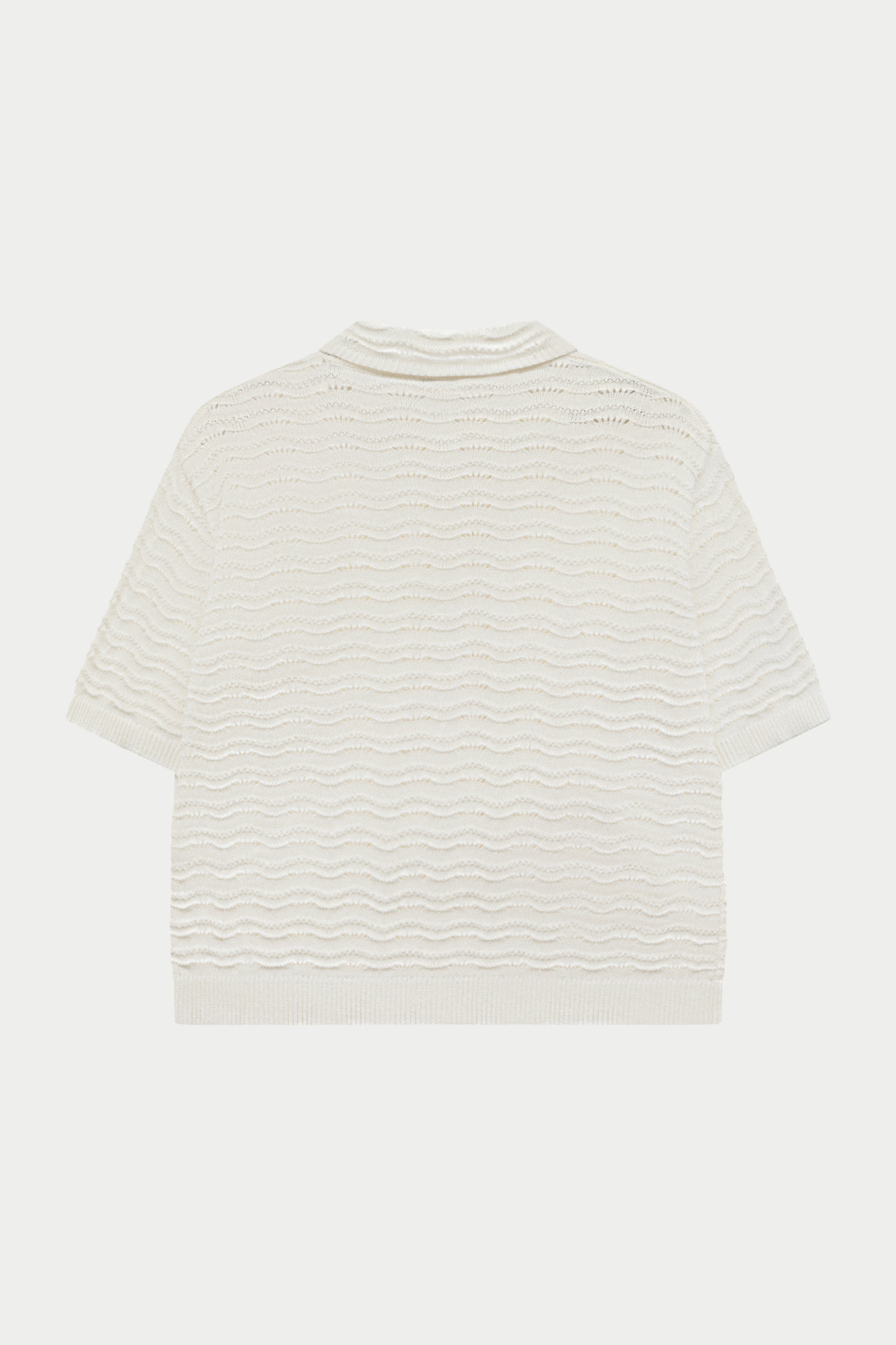 Off white crochet crochet knit shirt on a white background.