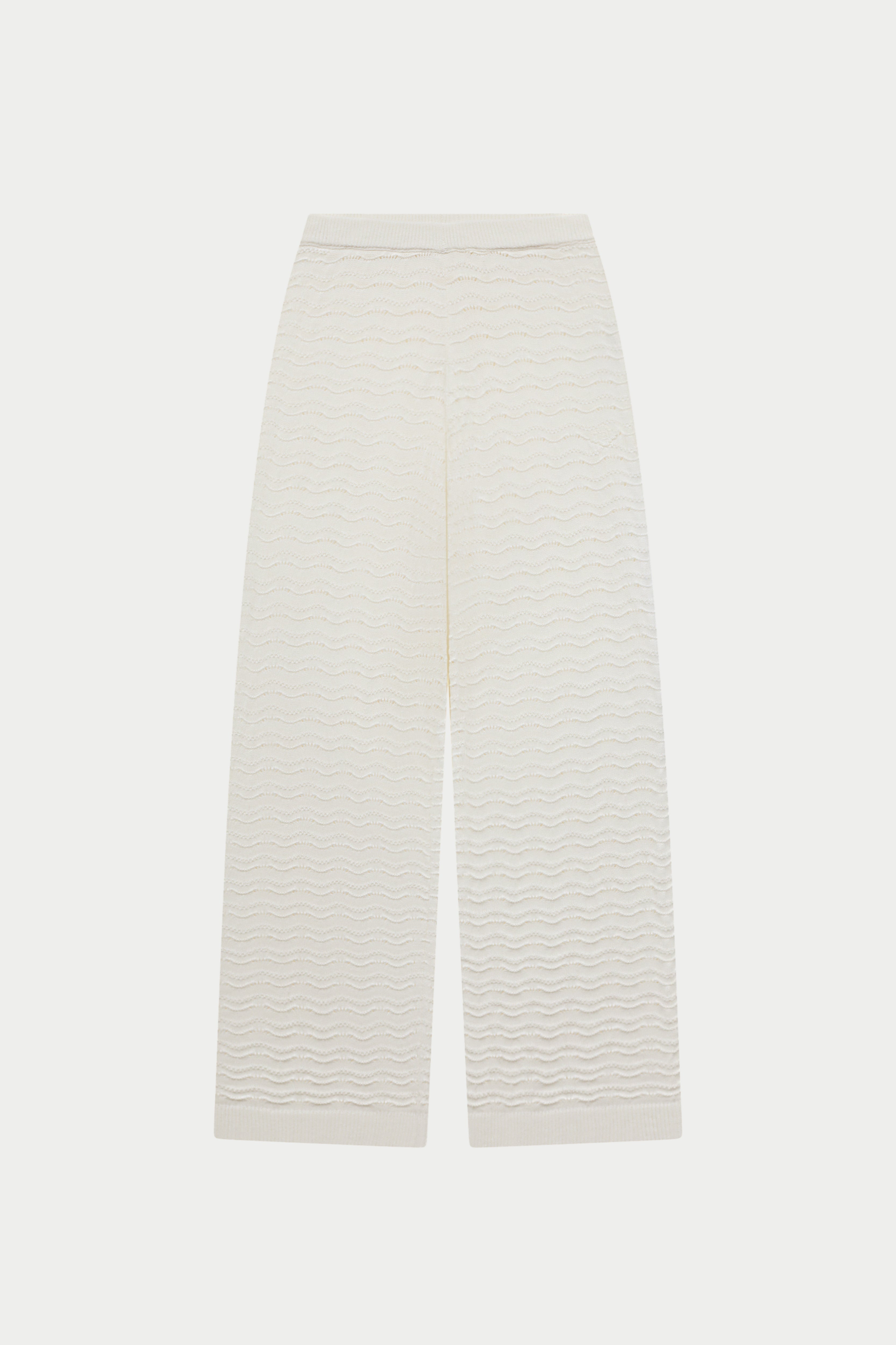 White crochet knit pants on a white background