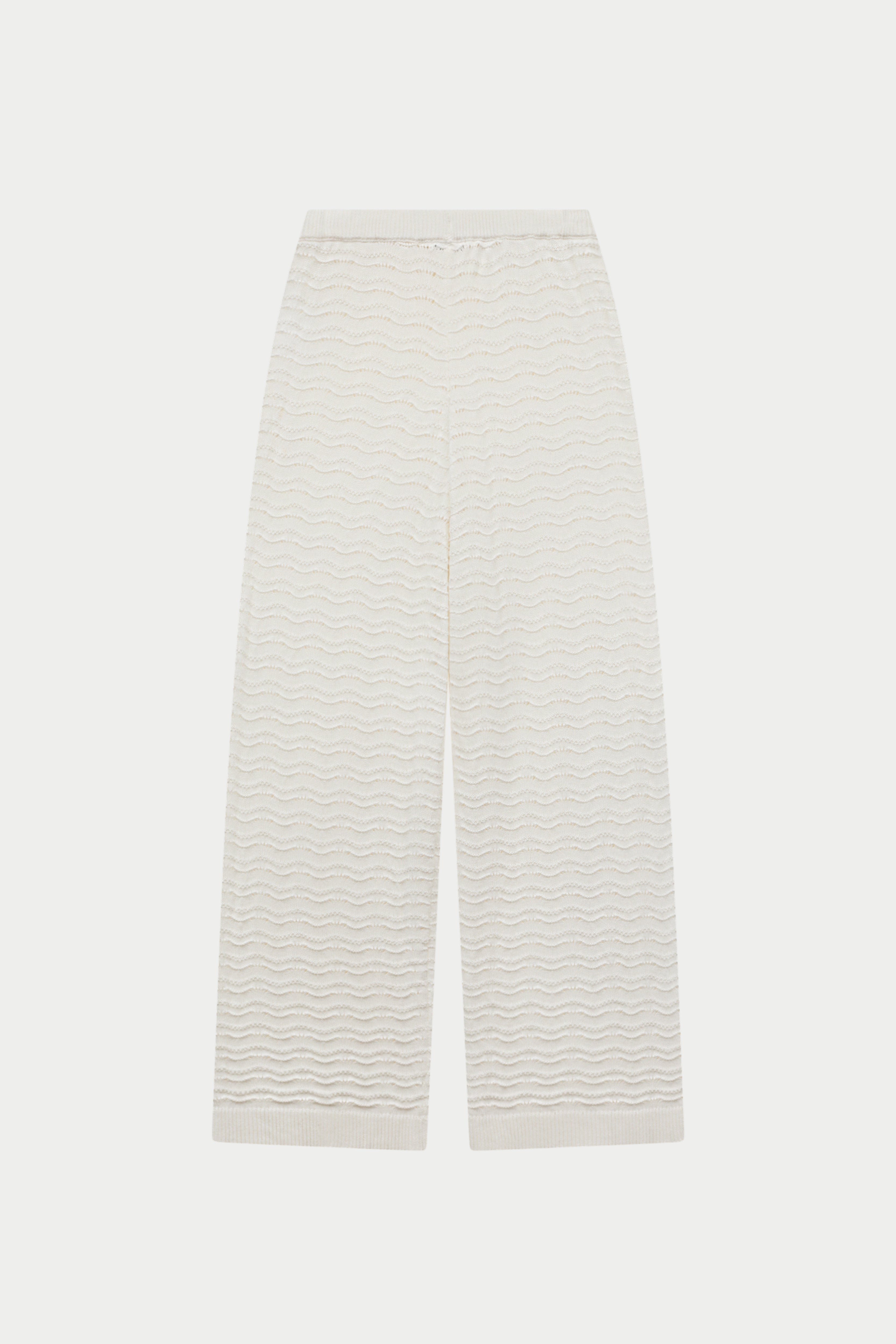 White crochet knit pants on a white background