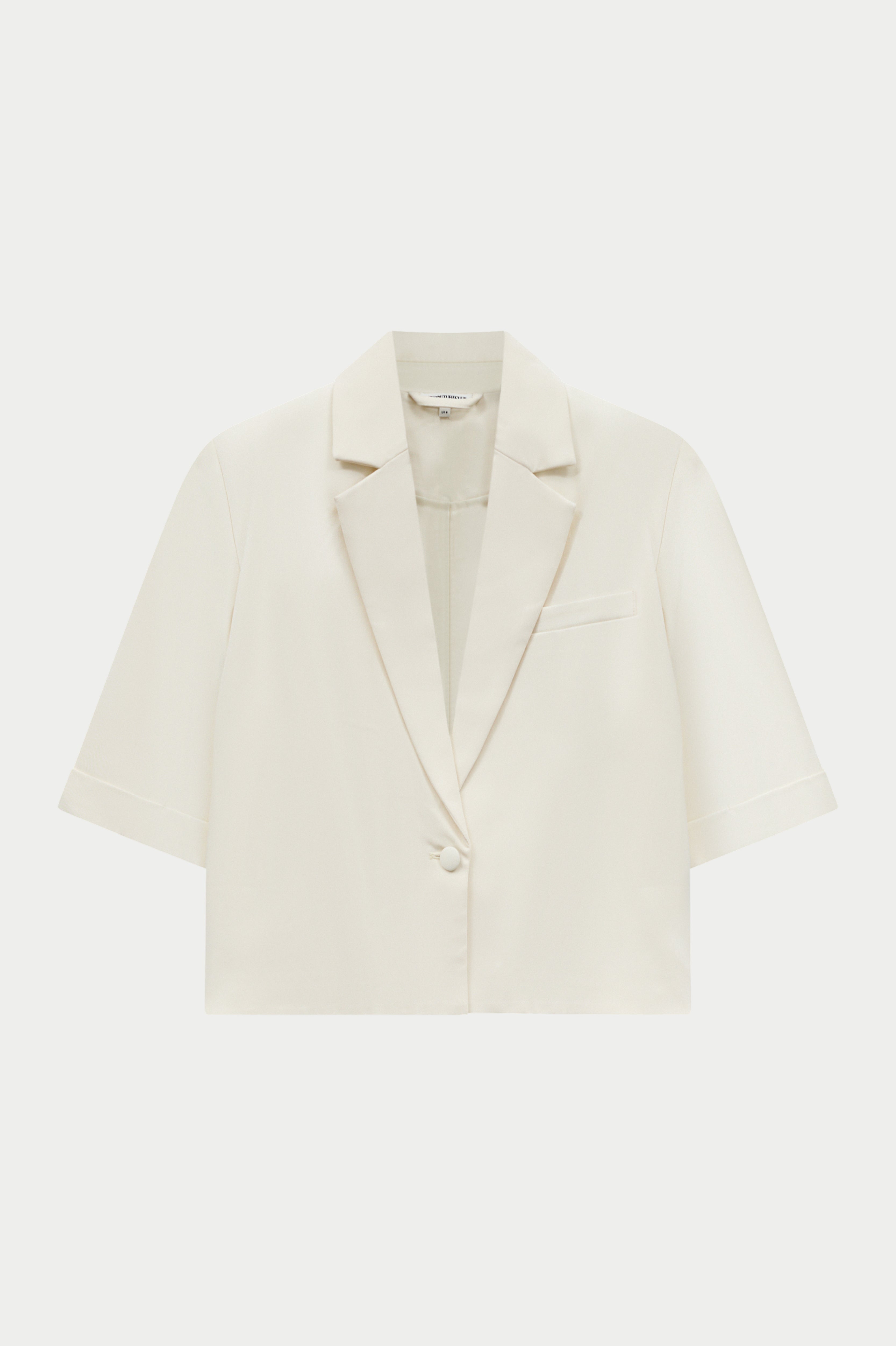 Off white blazer on a light white background