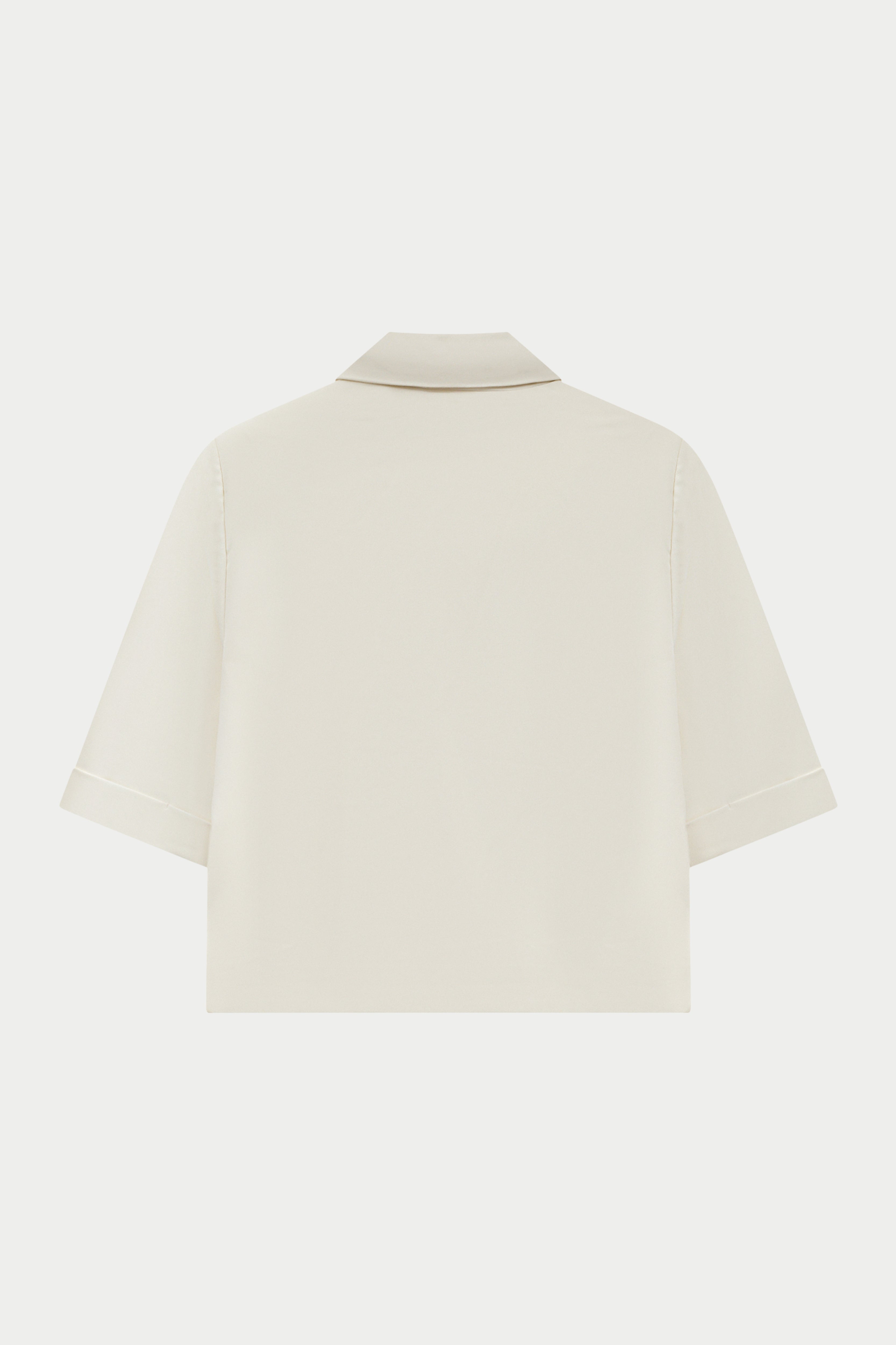 Off white blazer on a light white background
