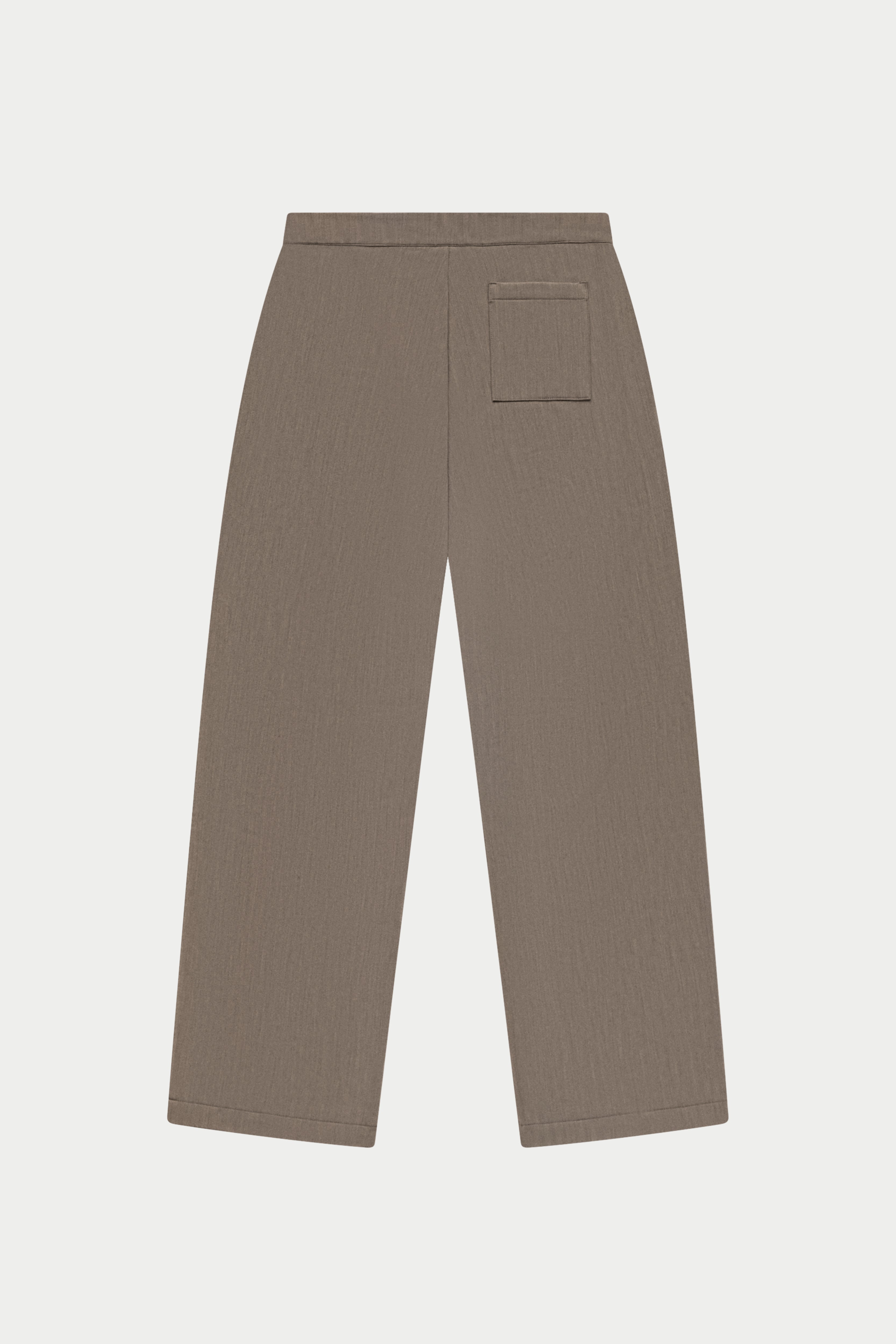 Brown tailored pants on a white background
