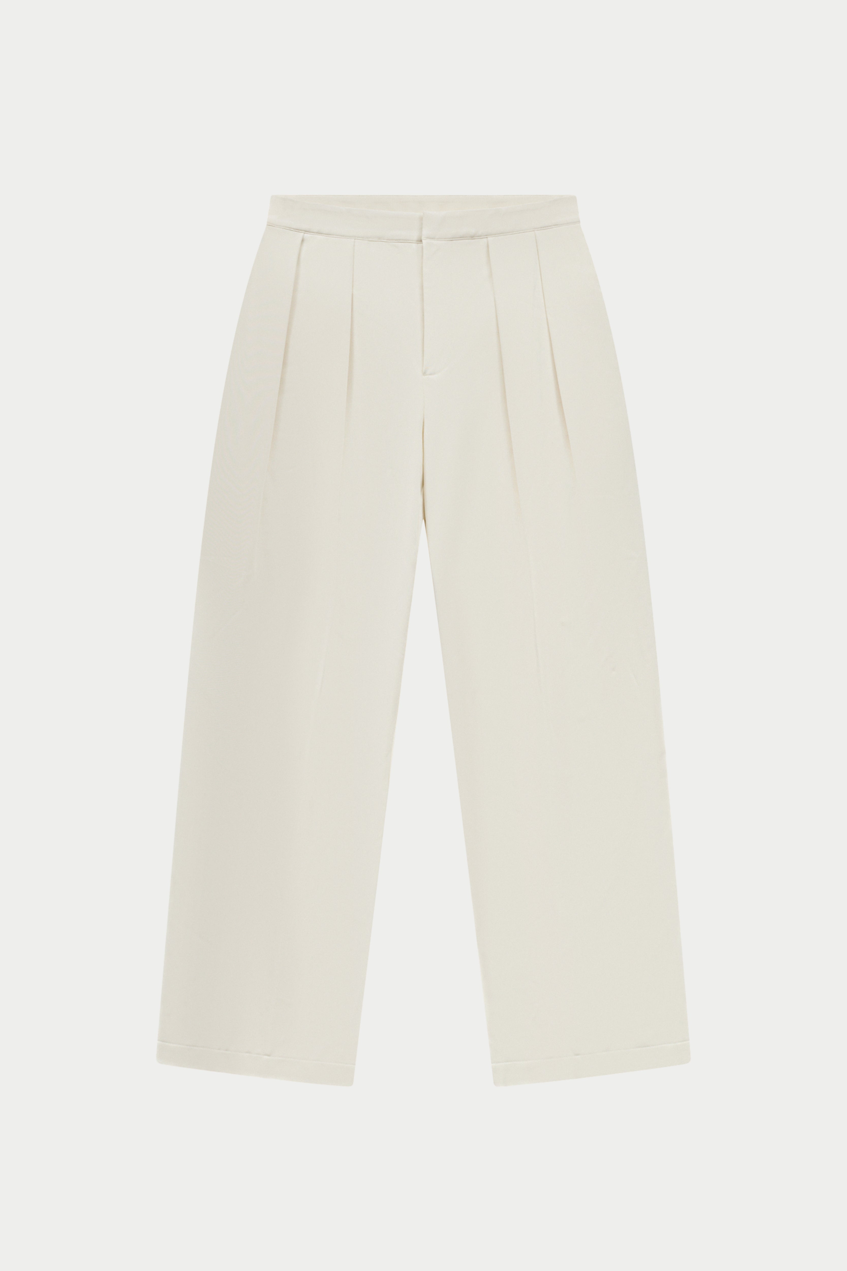 Off white tailored trousers on a white background