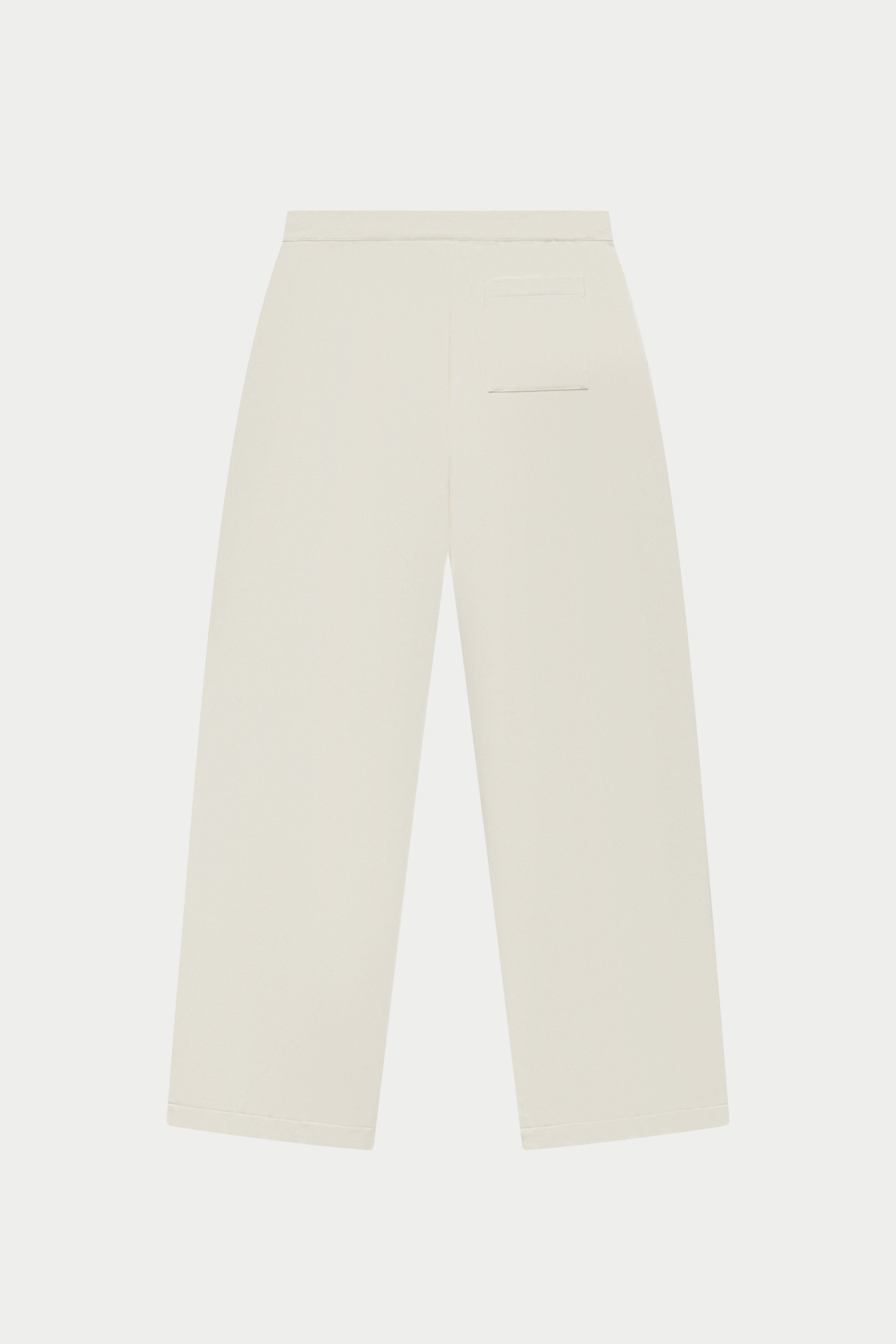 Off white tailored trousers on a white background