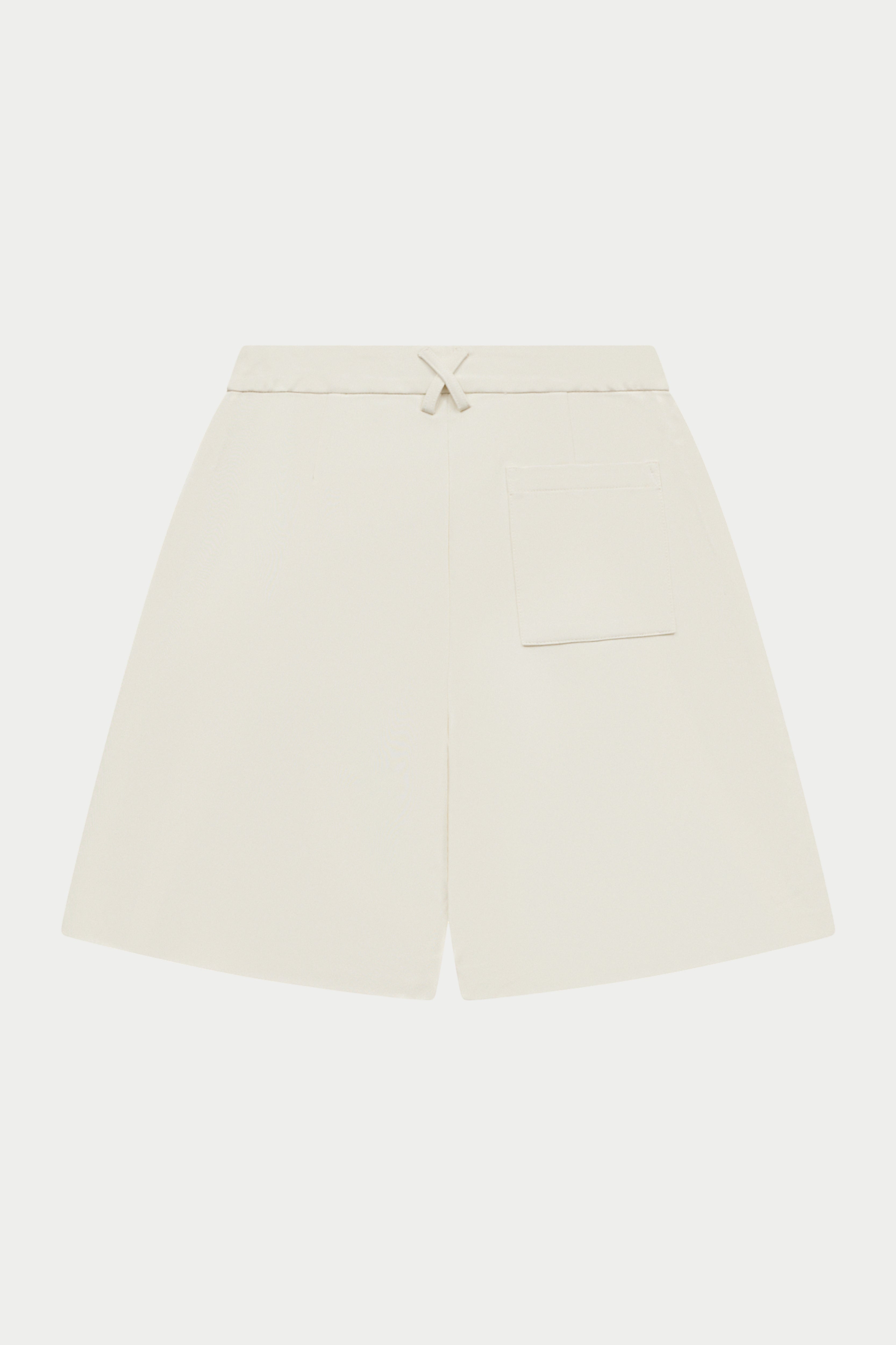 Off white tailored high waisted shorts on a white background