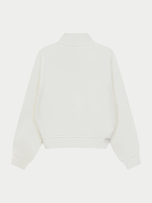 Off white quarter zip sweatshirt on a white background
