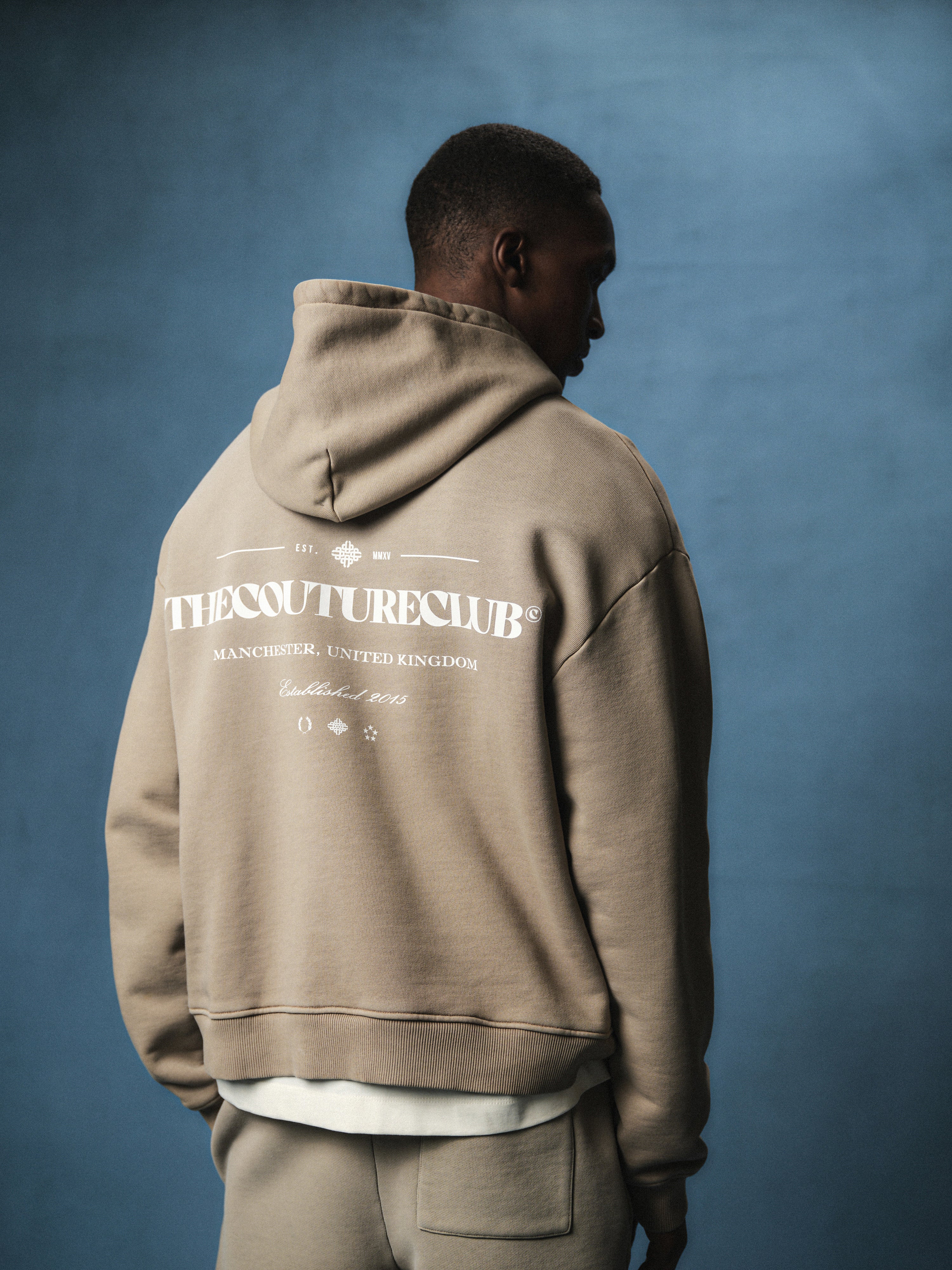 SPRAY WASH COPYRIGHT MULTI GRAPHIC HOODIE - BEIGE