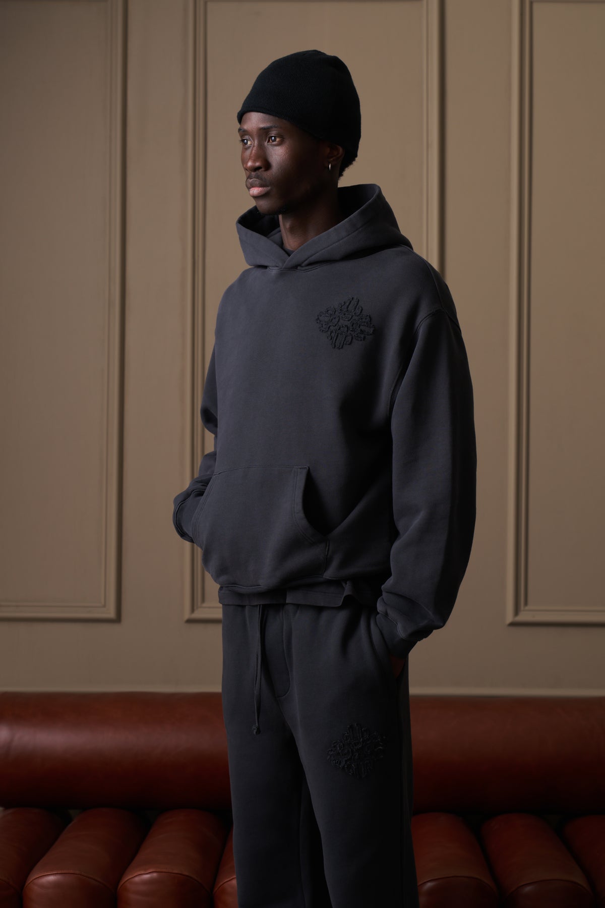 DISTRESSED EMBLEM APPLIQUE HOODIE - BLACK