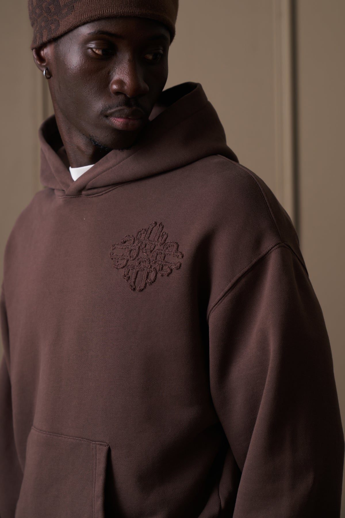 DISTRESSED EMBLEM APPLIQUE HOODIE - BROWN