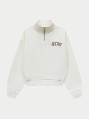 Off white quarter zip sweatshirt on a white background